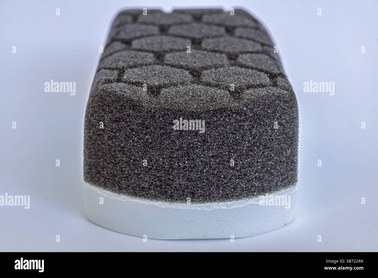Car detailing applicator pad, black grey foam sponge with hexagon pattern Stock Photo