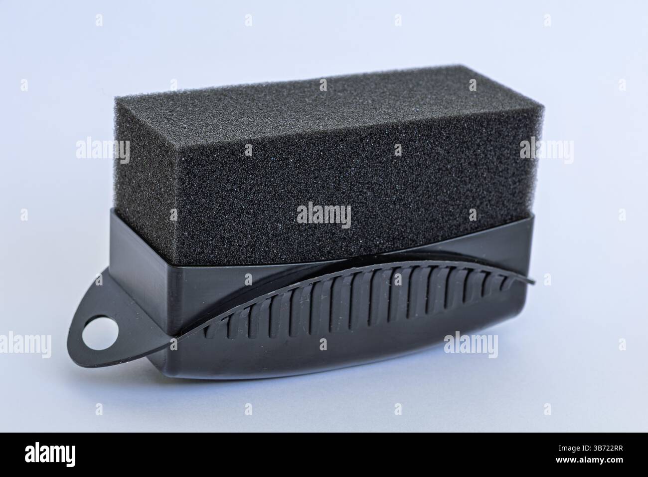 Black tire shine foam applicator for car detailing isolated on white background Stock Photo