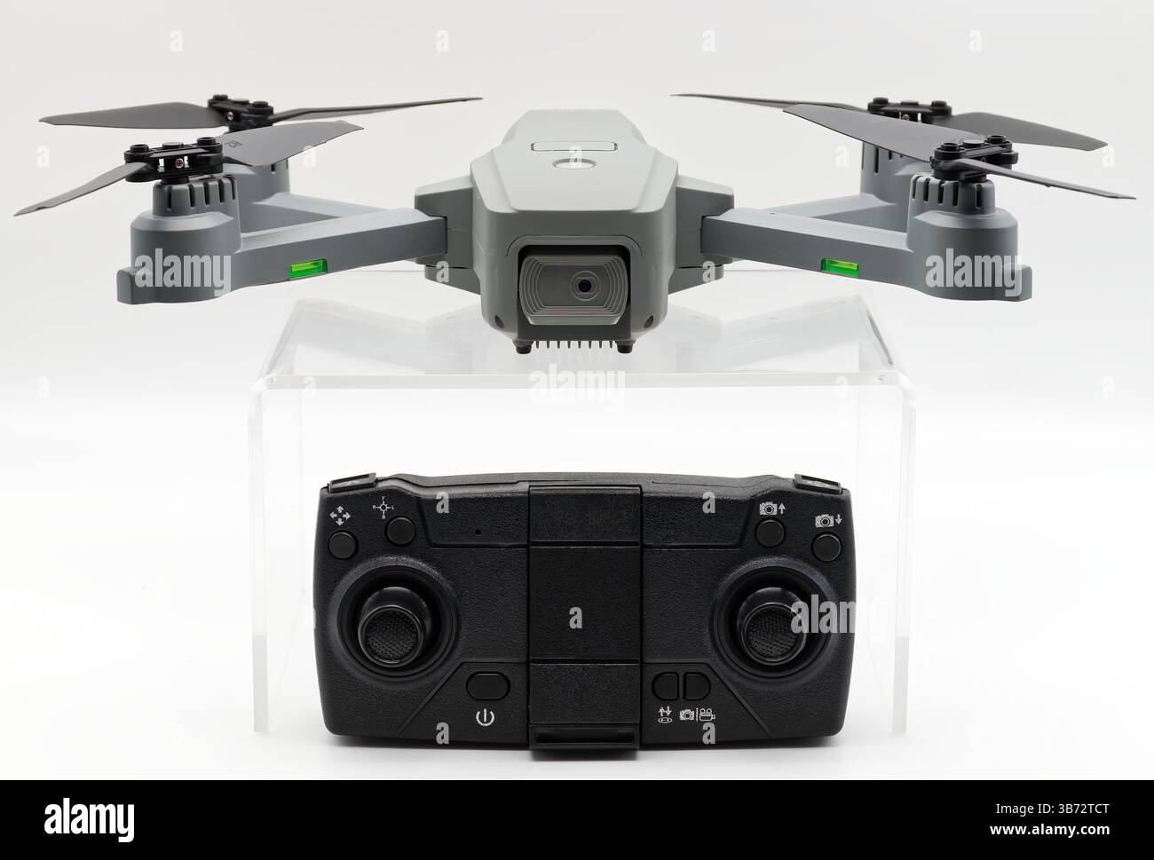 Gray drone and remote control isolated on white background. Stock Photo