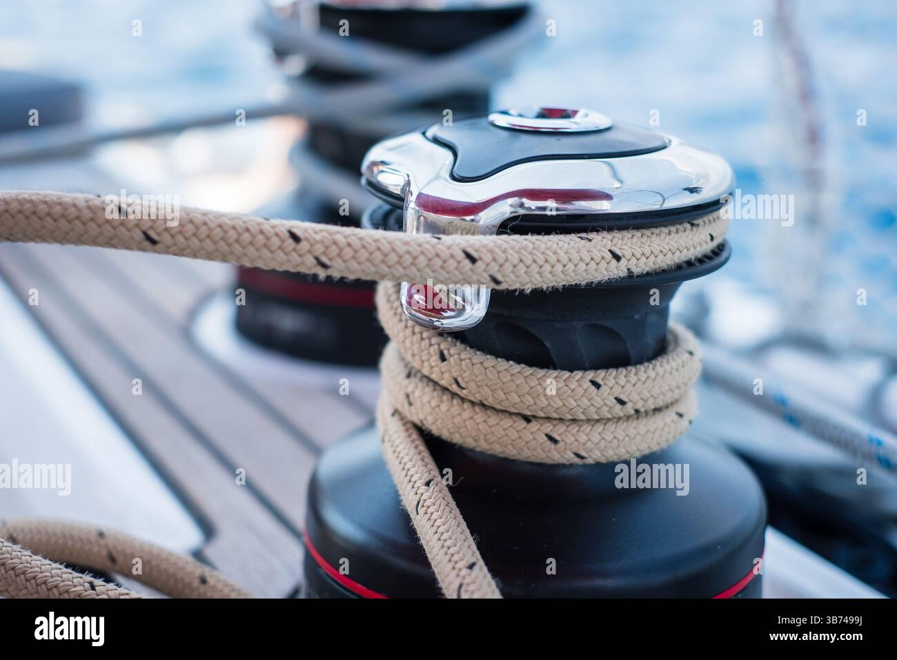 Sailing yacht ropes and winch. Sailboat equipment details. Water ...