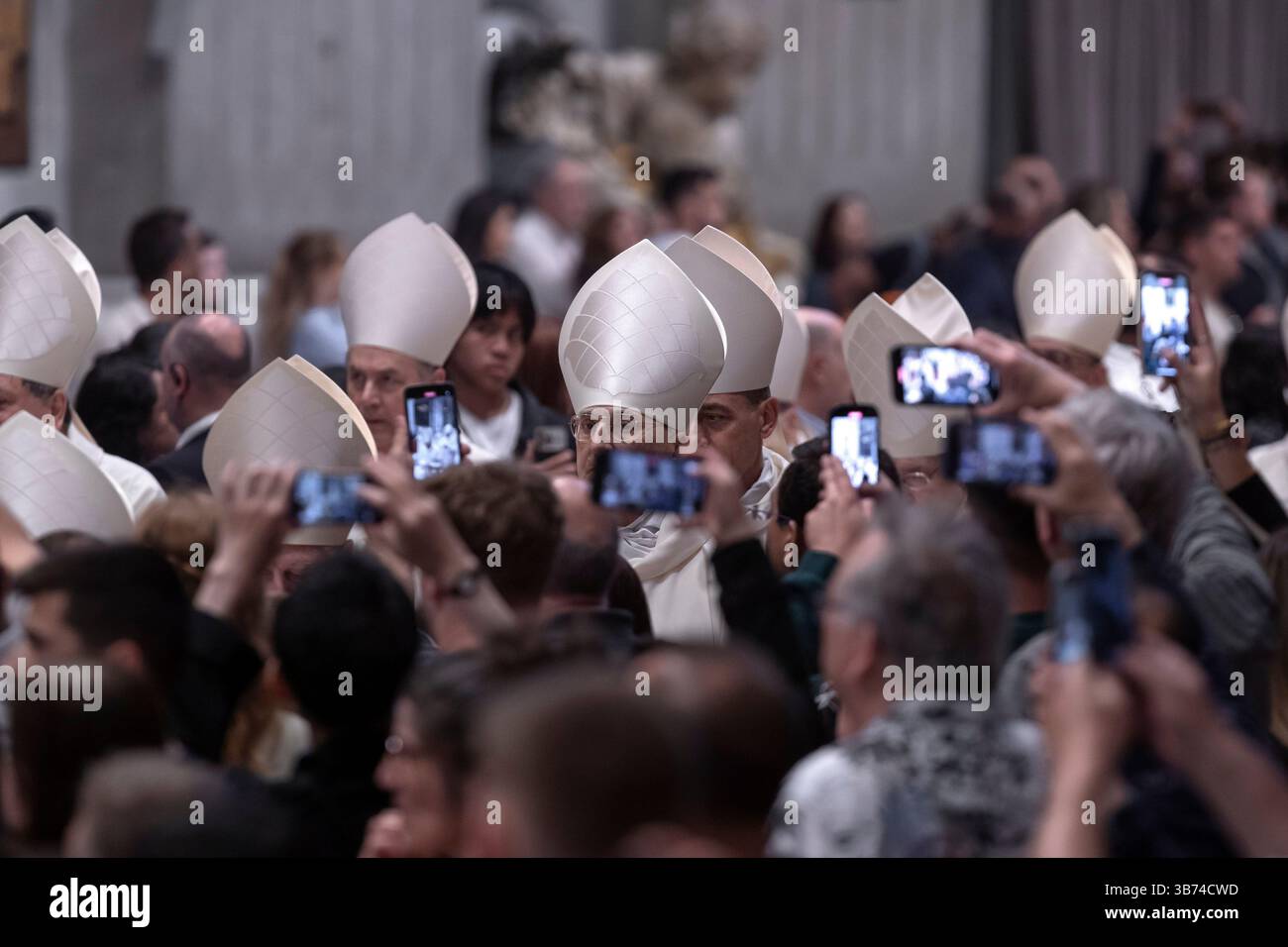 Cardinals arrive for a mass on the ninth day of
