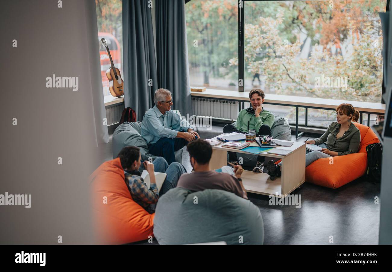Professor engaging with students in a casual learning environment Stock Photo