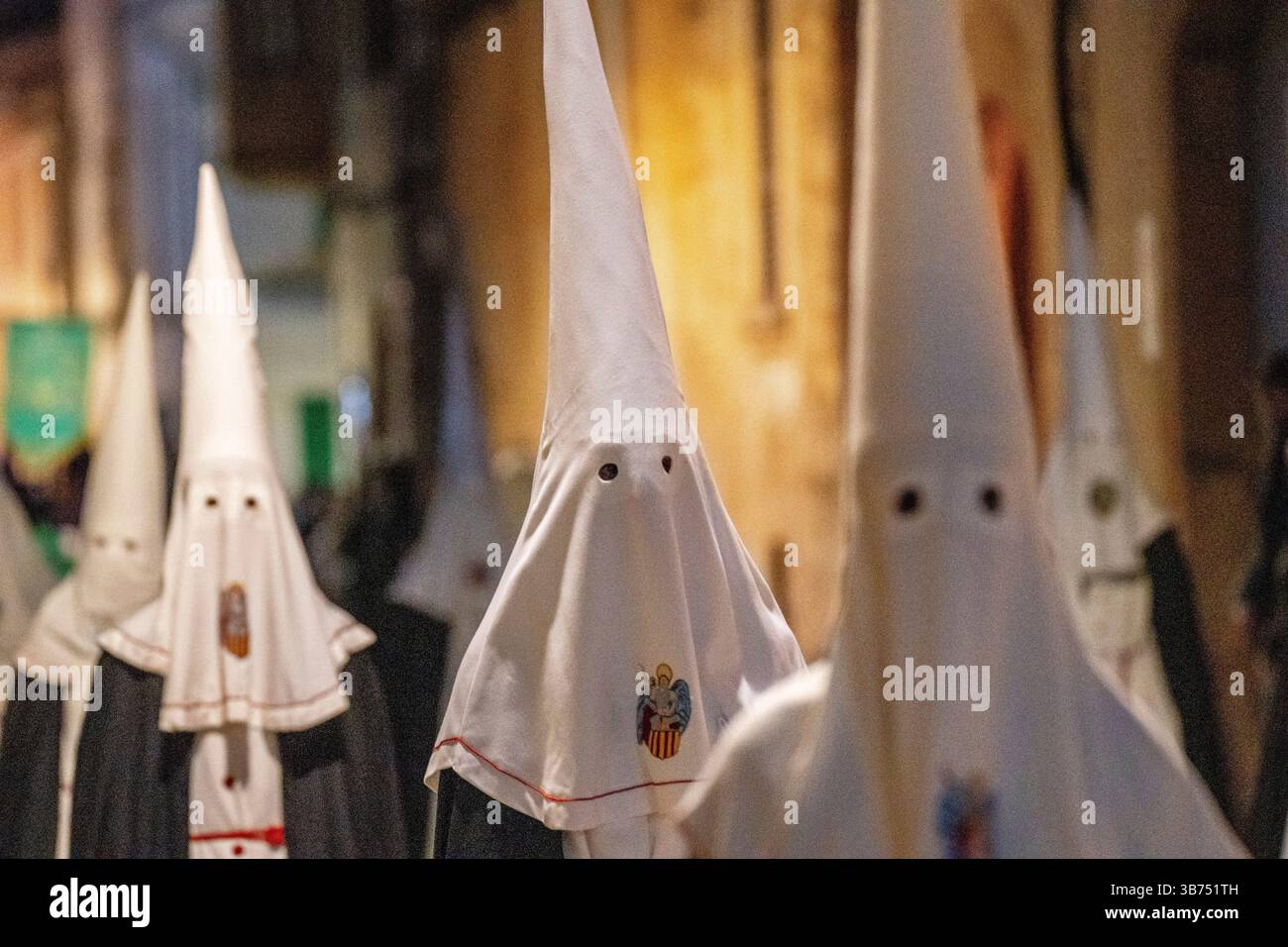 Holy Week Masks Hooded brothers with conical hats that serve as masks, Holy Week ...