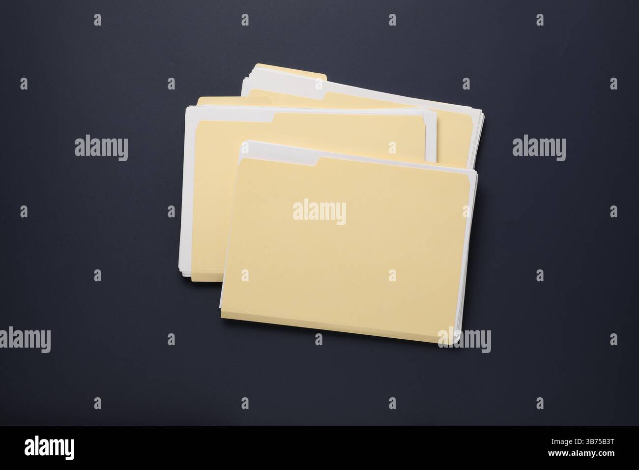 File folders with papers on dark background, top view Stock Photo