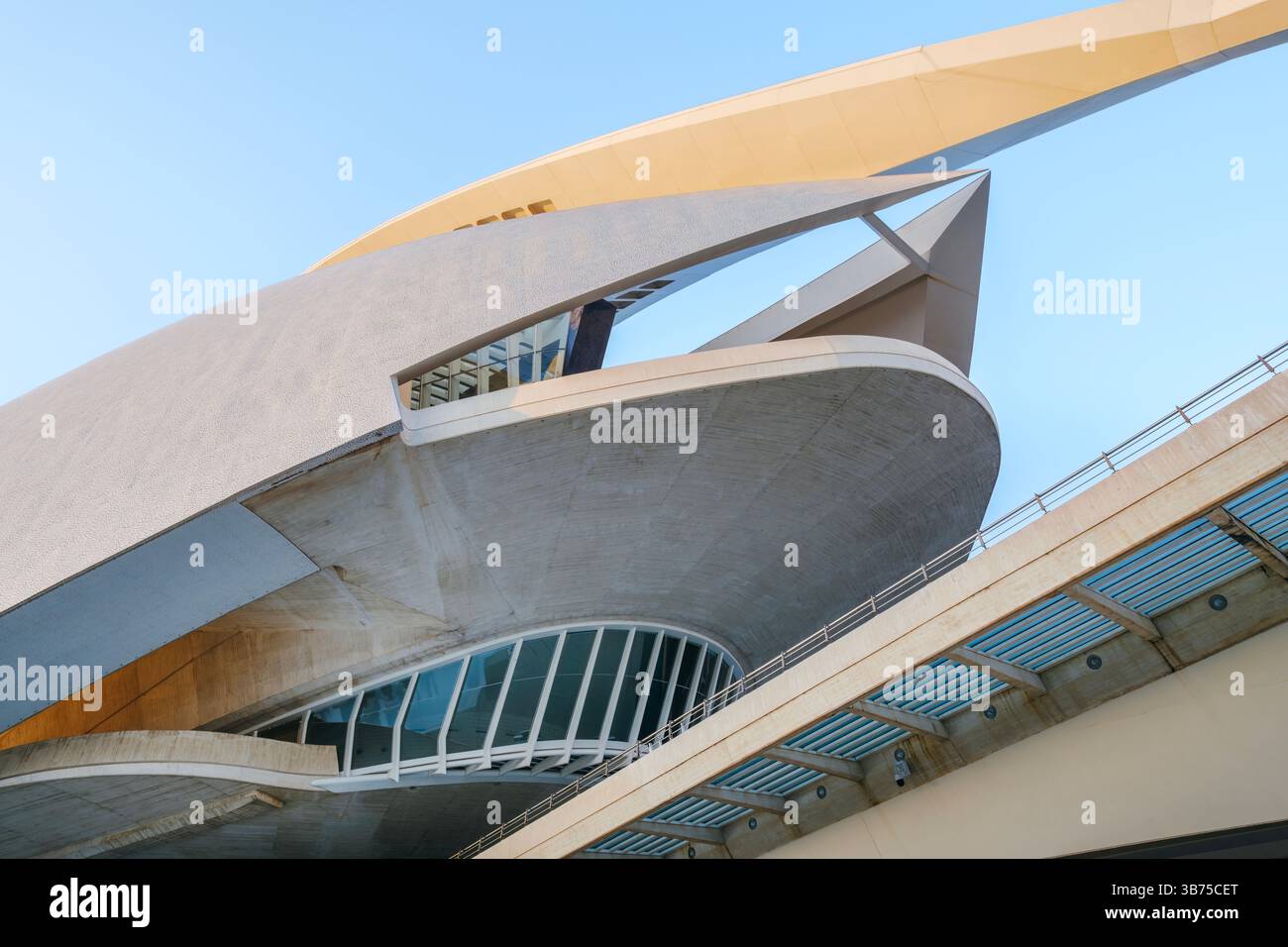 Perspective of the Palau de les Arts Reina Sofia against a clear blue sky. Dynamic upward perspective of the Palace of Arts. Unique perspective of Cit Stock Photo