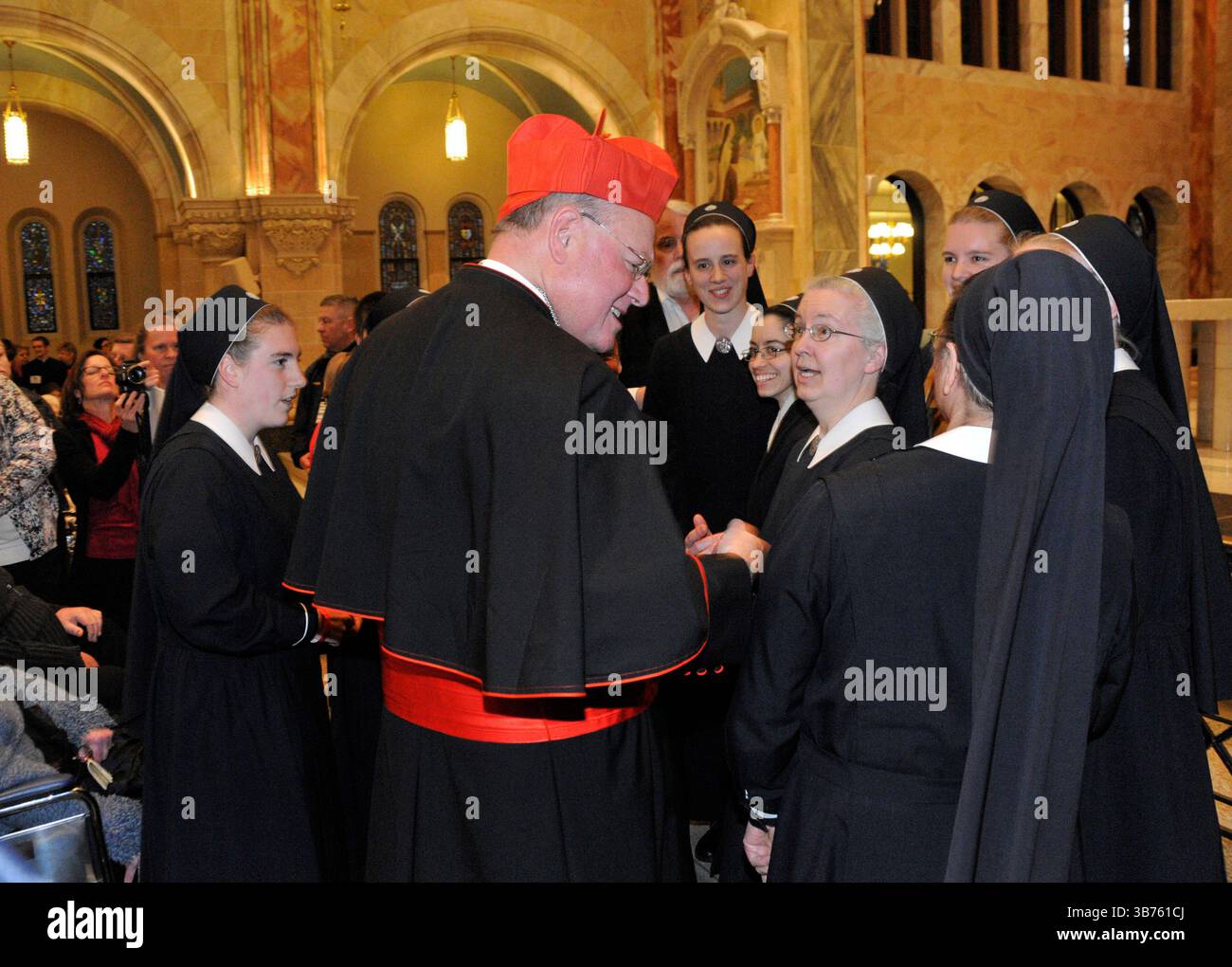 Cardinal Tim Dolan greets a group of nuns (no ids on this group) to the Holy Hill basilica in Hubertus, Wis., prior to his mass of thanksgiving on Saturay, April 28, 2012. Ernie Mastroianni photo. Stock Photo