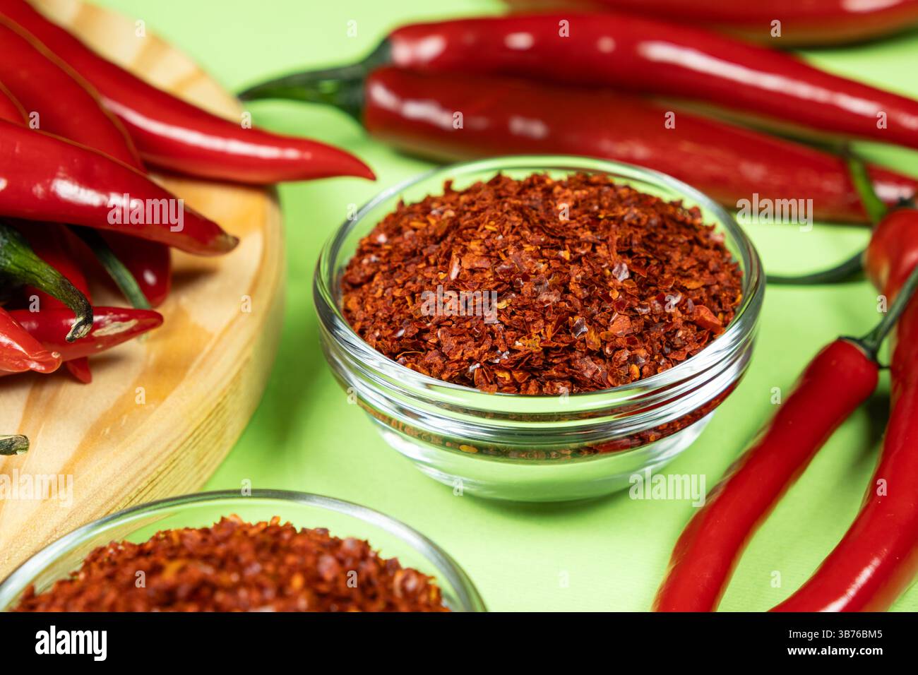 Dried Chili Seasoning with Fresh Chili Peppers. Stock Photo