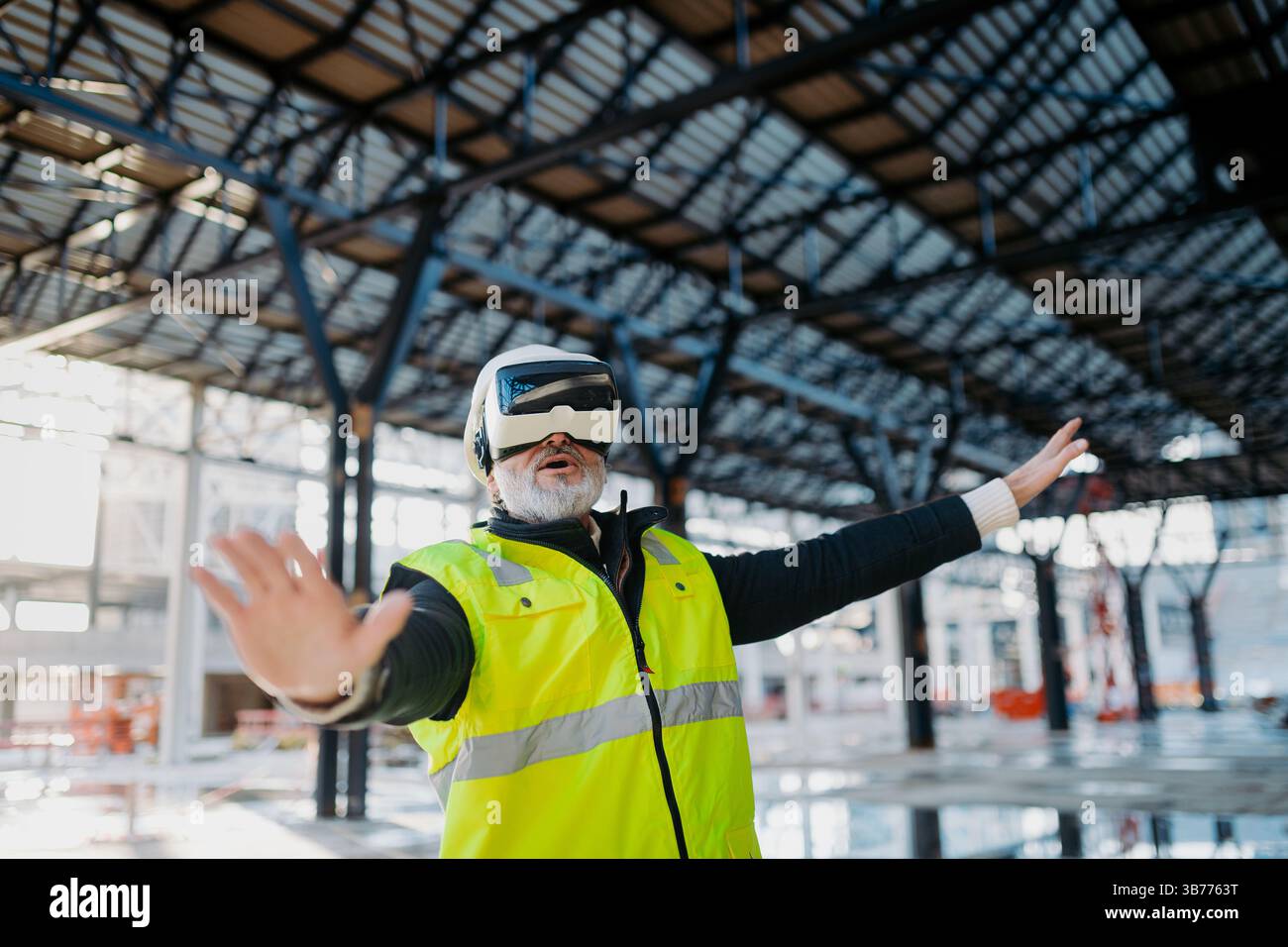 Engineer using virtual reality to inspect building progress. Stock Photo