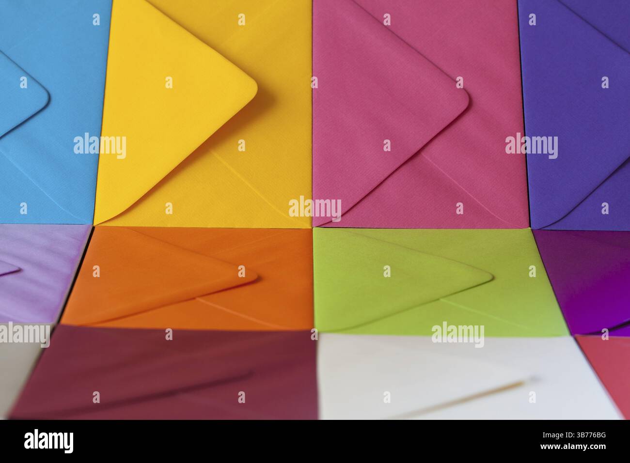 Different colored envelopes on the table. Composition with envelopes on the table Stock Photo