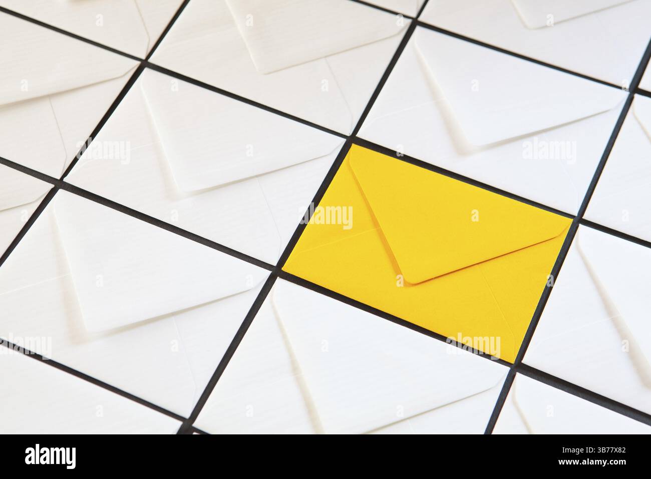 Composition with white and yellow, envelopes on the table. Different colored envelopes on the table Stock Photo