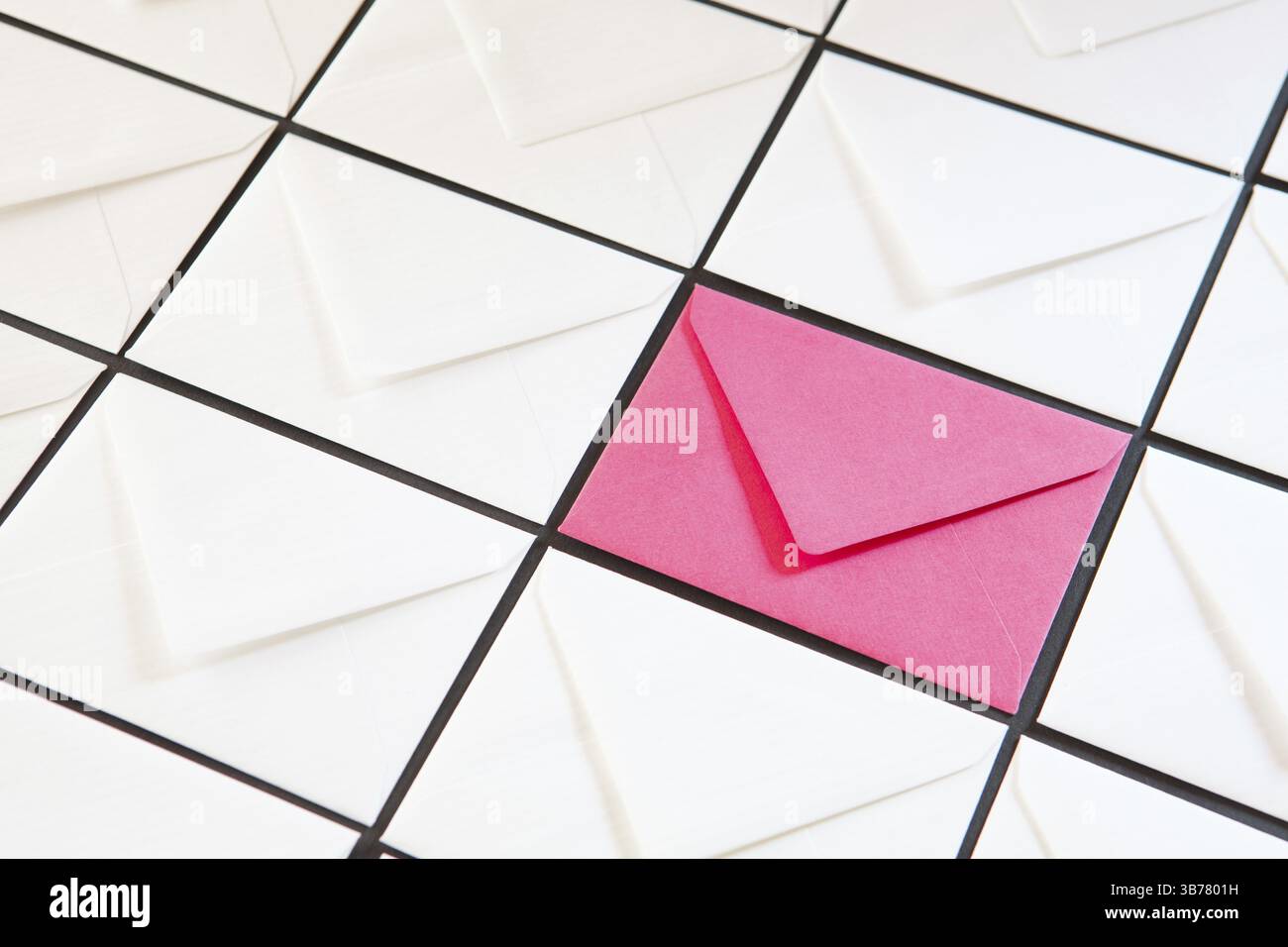 Composition with white and pink envelopes on the table. Different colored envelopes on the table Stock Photo