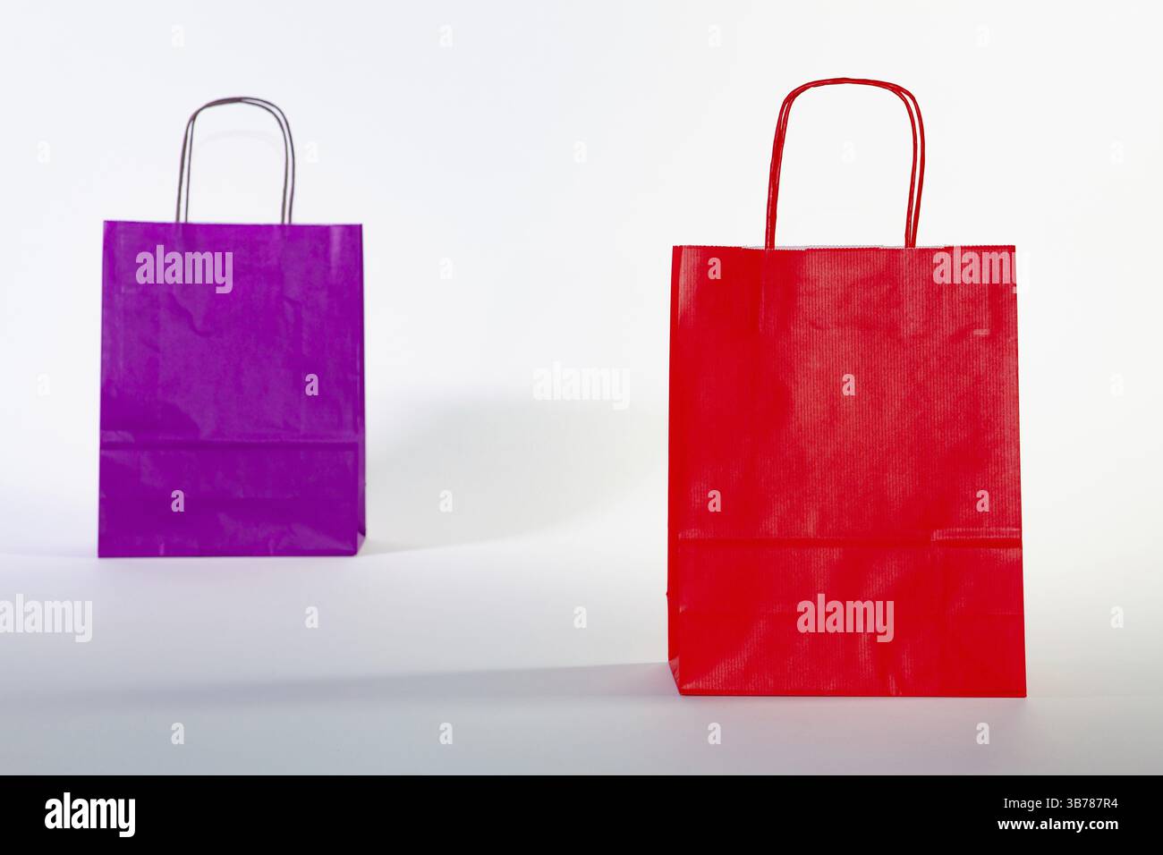 Set of colorful empty shopping bags isolated on the white background ...