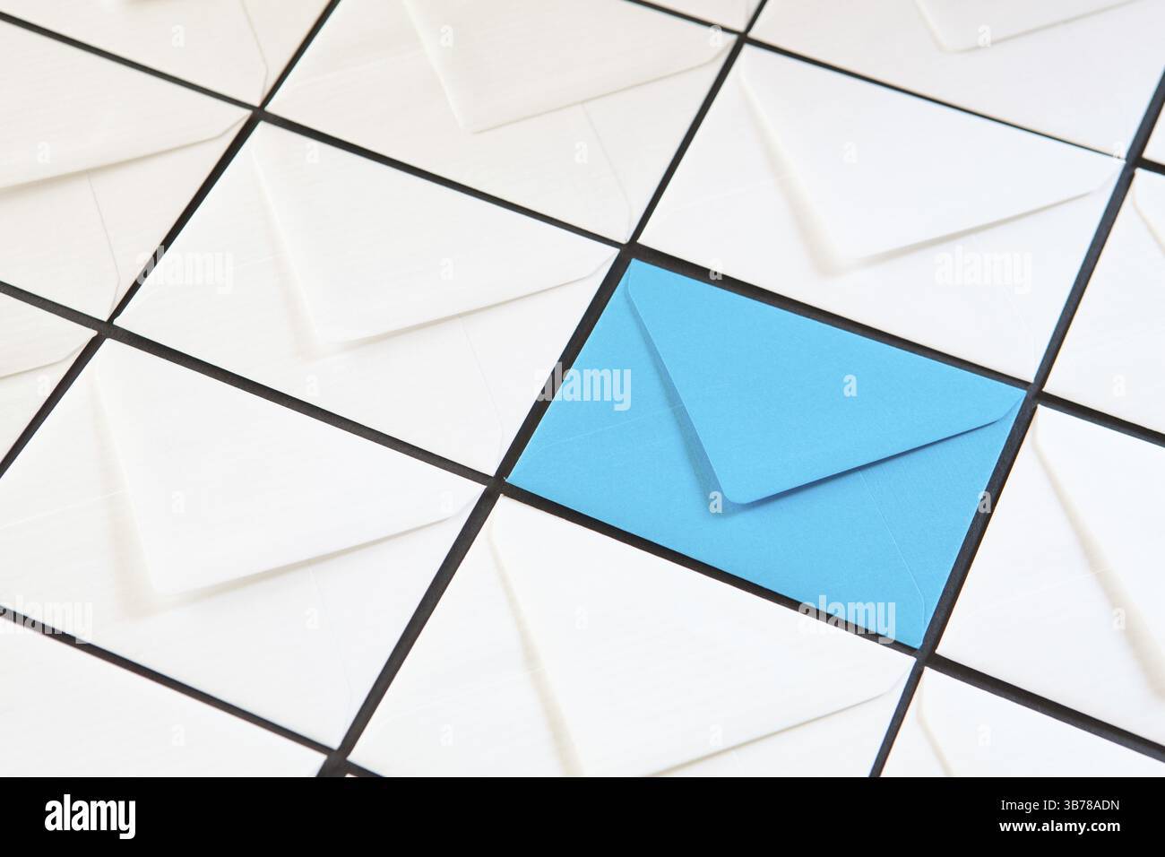 Composition with white and blue envelopes on the table. Different colored envelopes on the table Stock Photo