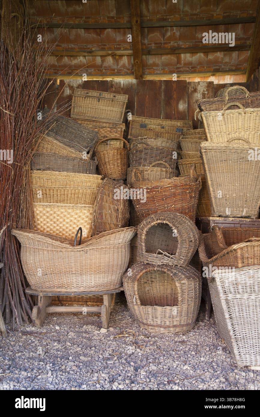 Different history wicker baskets in the old barn Stock Photo