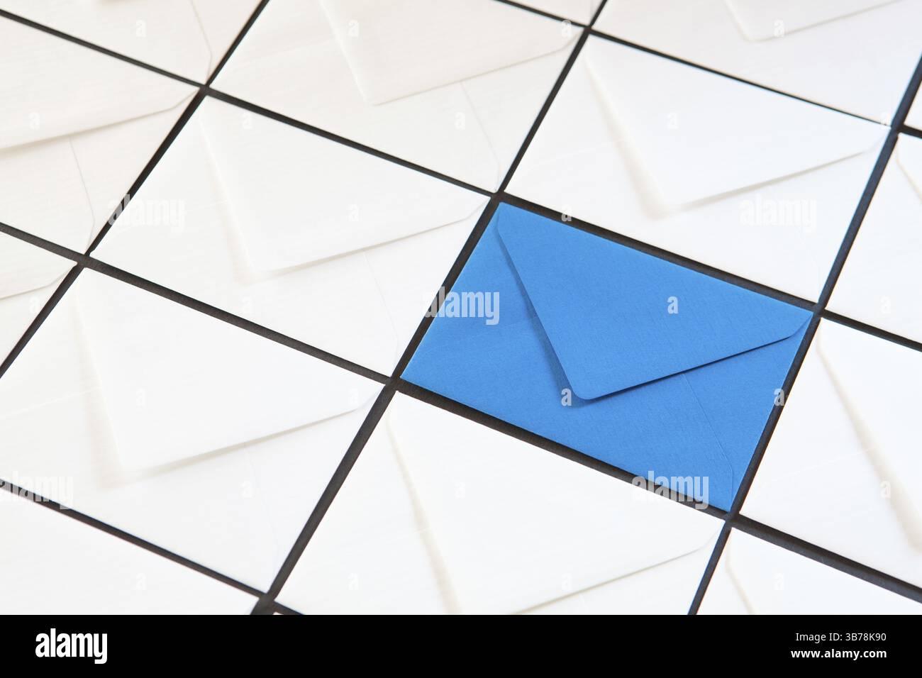 Composition with white and blue envelopes on the table. Different colored envelopes on the table Stock Photo