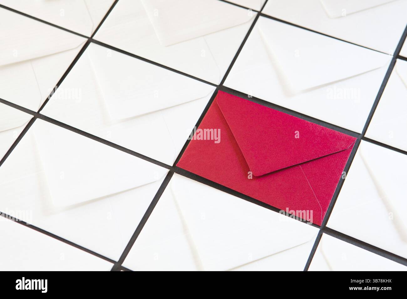 Composition with white and red envelopes on the table. Different colored envelopes on the table Stock Photo