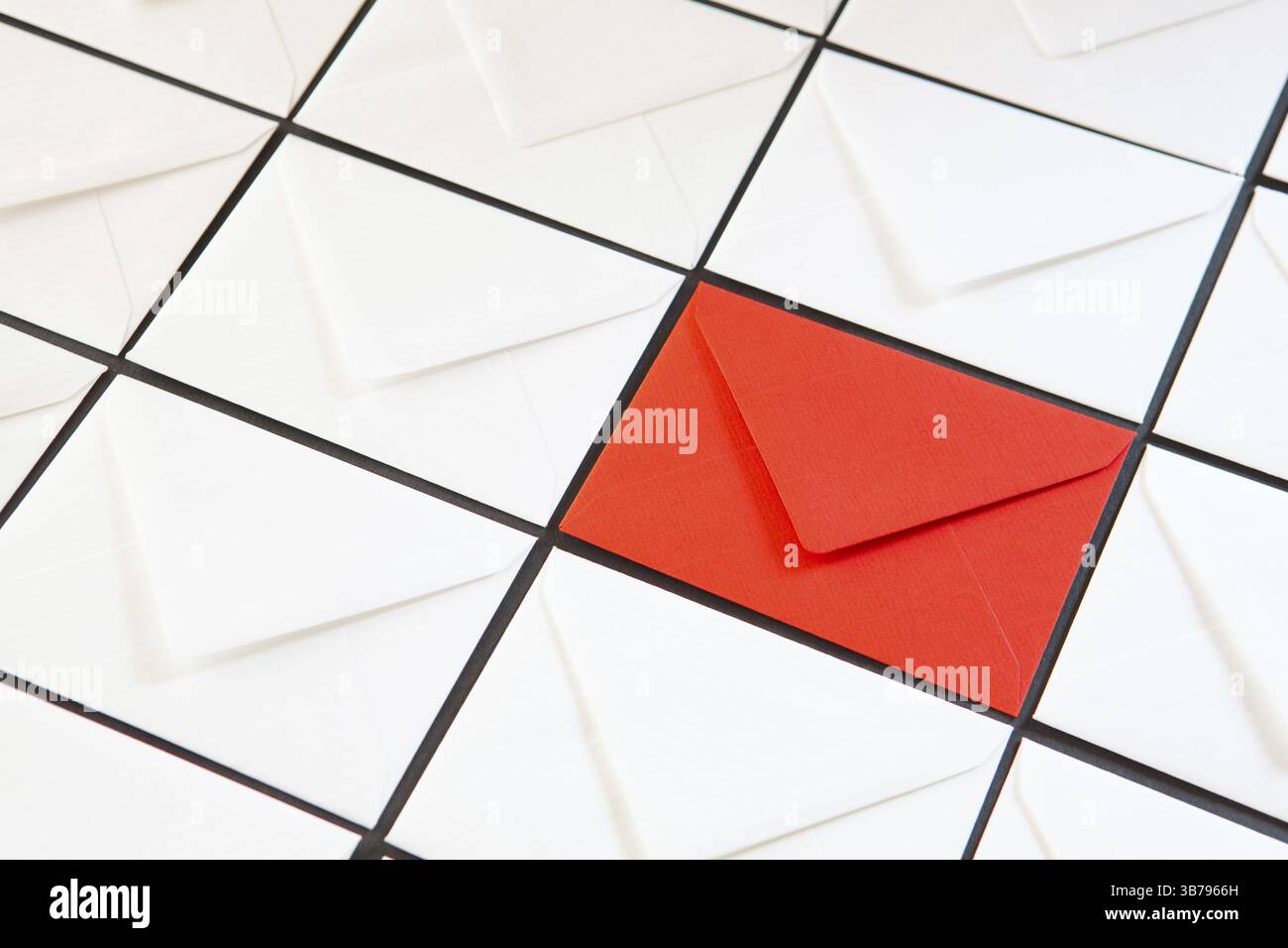 Composition with white and red envelopes on the table. Different colored envelopes on the table Stock Photo