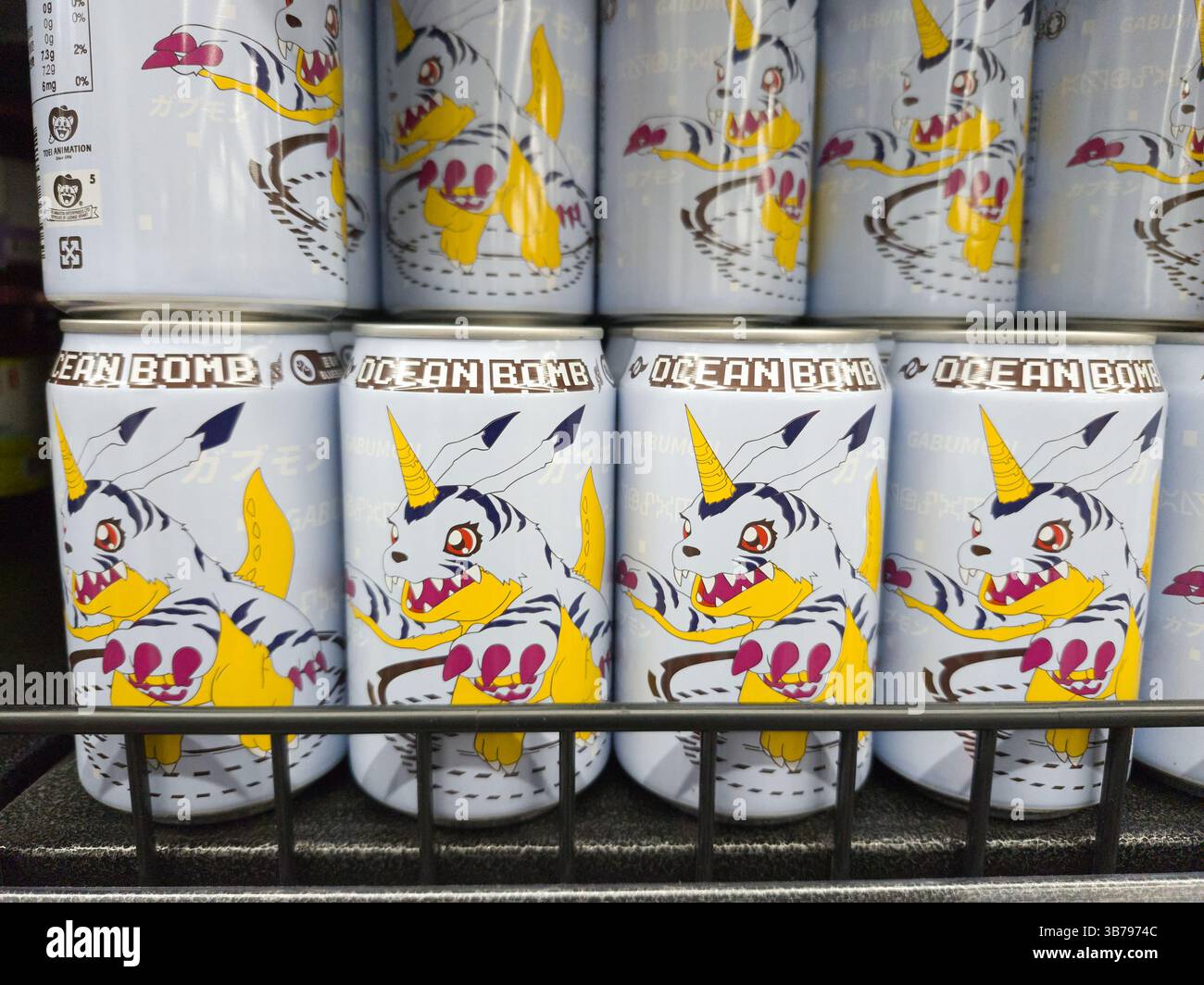 Ocean Bomb- Digimon Adventure Gabumon Sparkling water . Shelf display of side unit cans. - Smartphone Captured Stock Image