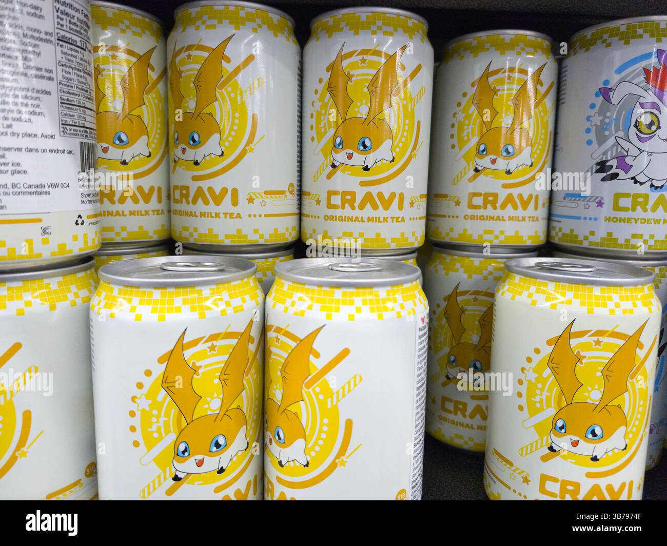 Cravi - Original Milk Tea Flavour Beverage. Shelf display of side unit cans. - Smartphone Captured Stock Image