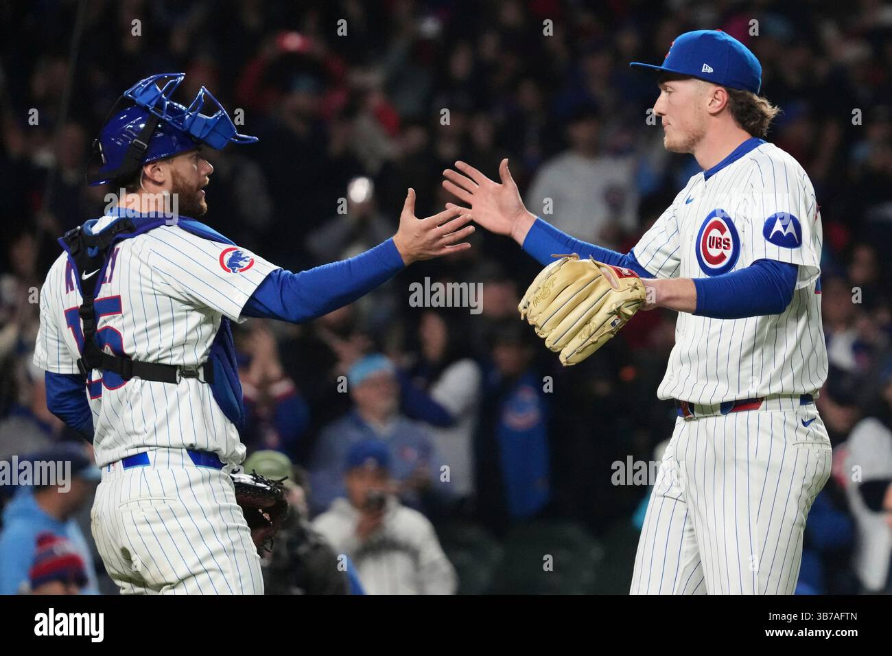 Chicago Cubs catcher Carson Kelly, left, celebrates with relief pitcher ...
