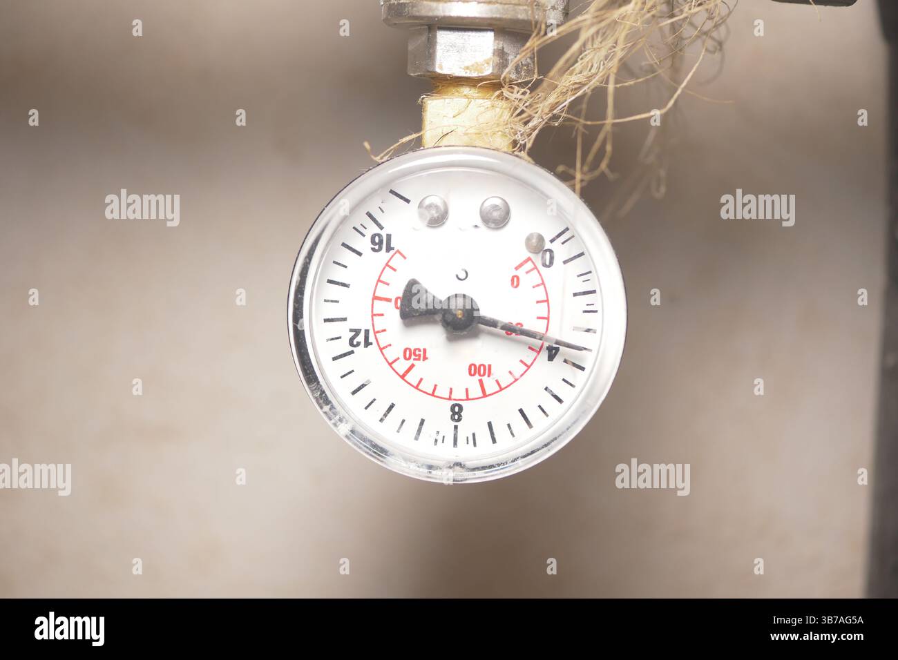 Pressure gauge showing measurement in industrial setting Stock Photo ...