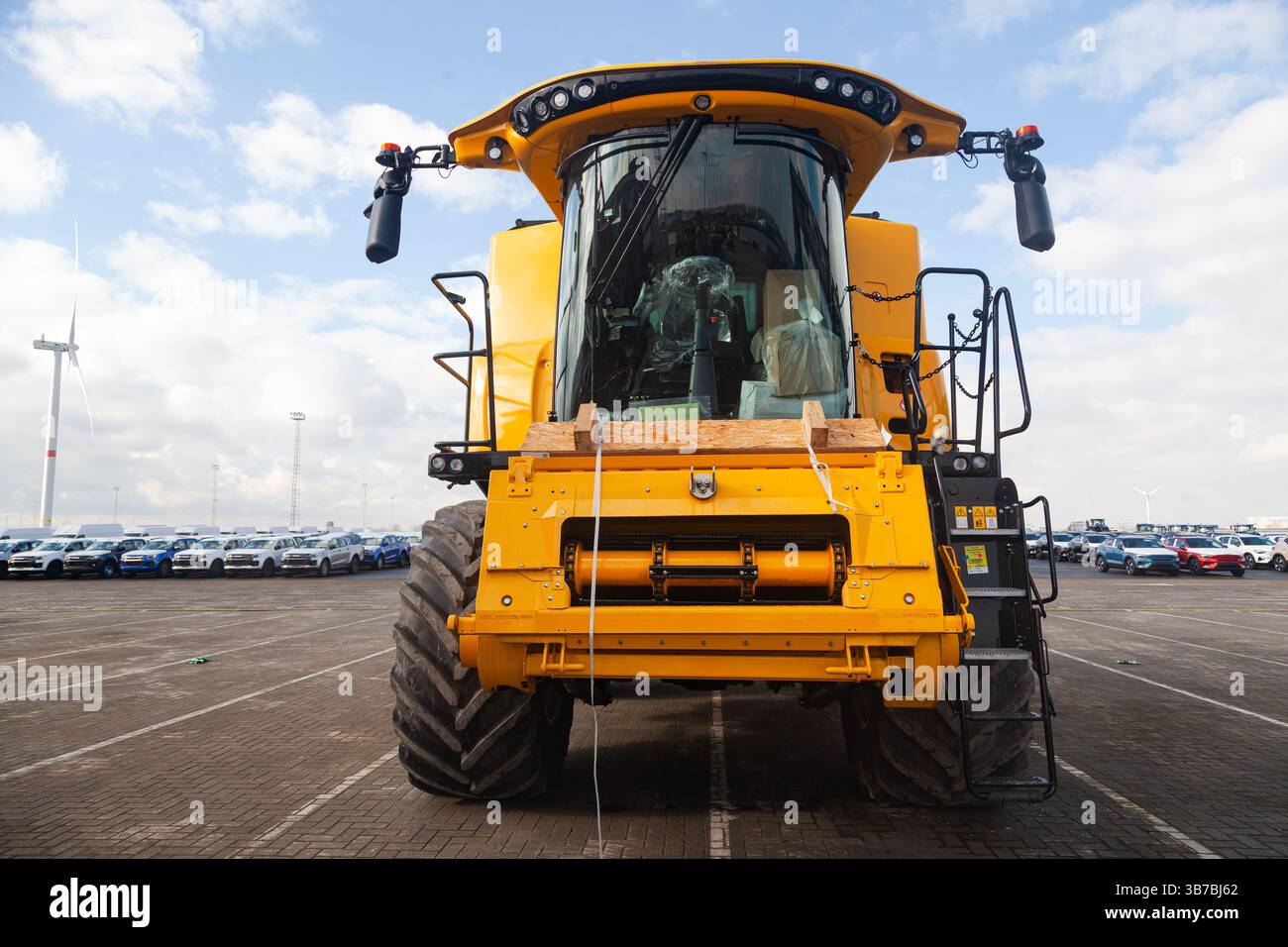 New yellow heavy bulldozer without bucket parked on the site. Stock Photo
