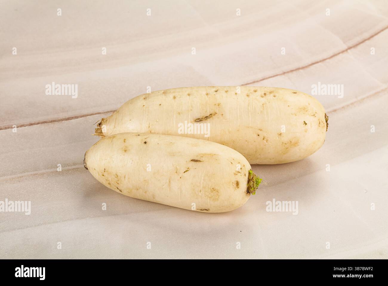 Raw white daikon raddish root for cooking Stock Photo - Alamy