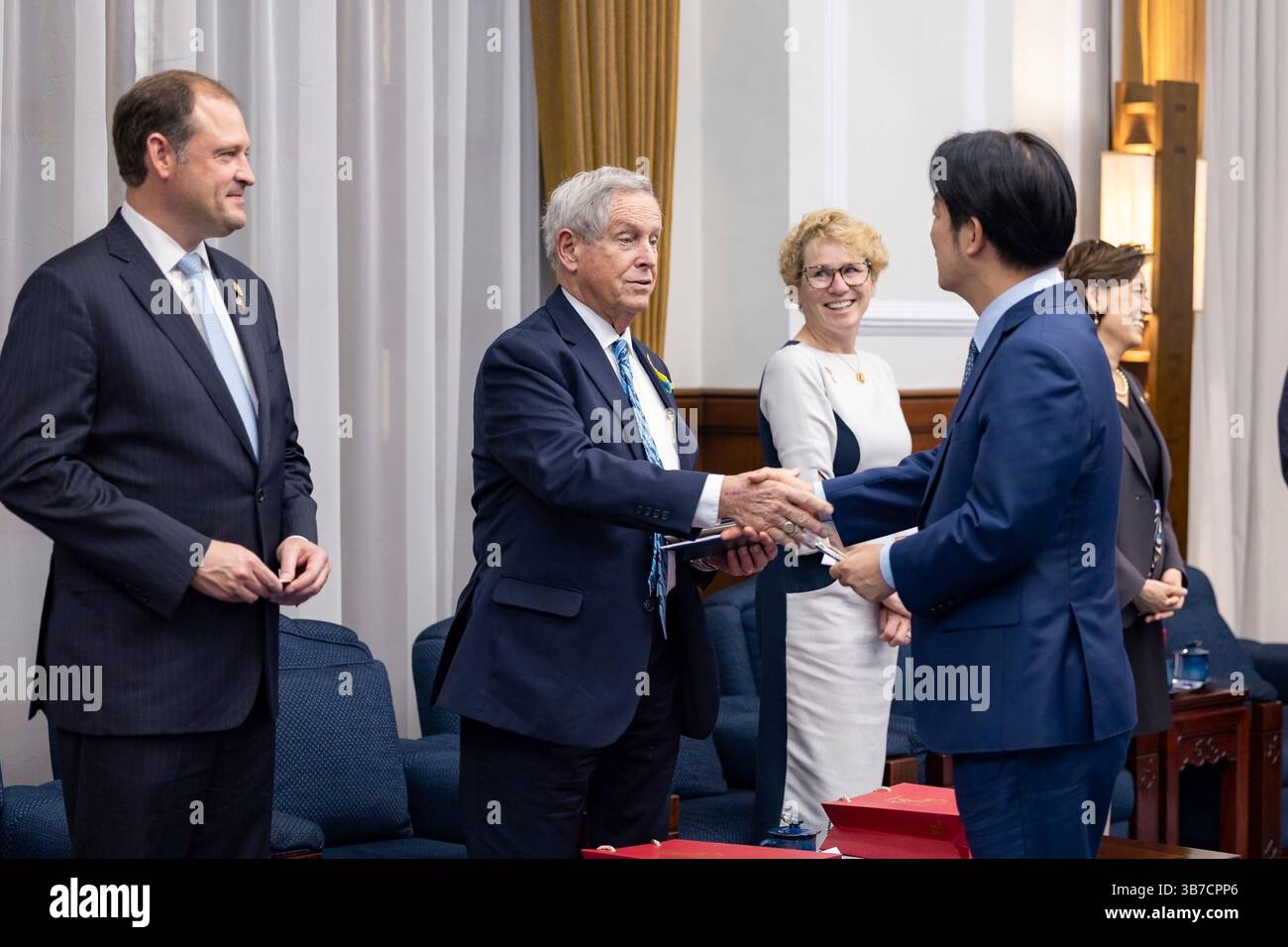 May 27, 2024, Taipei, Republic of China: U.S Rep. Joe Wilson, R-SC, center, part of a bipartisan delegation, shakes hands with Taiwan President Lai Ching-te, right, before the meeting at the Presidential Office, May 27, 2024, in Taipei, Taiwan. The visit was the first by American politicians since Lai took office last week. (Credit Image: © Liu Shu Fu/Taiwan Presidential/Planet Pix via ZUMA Press Wire) Stock Photo