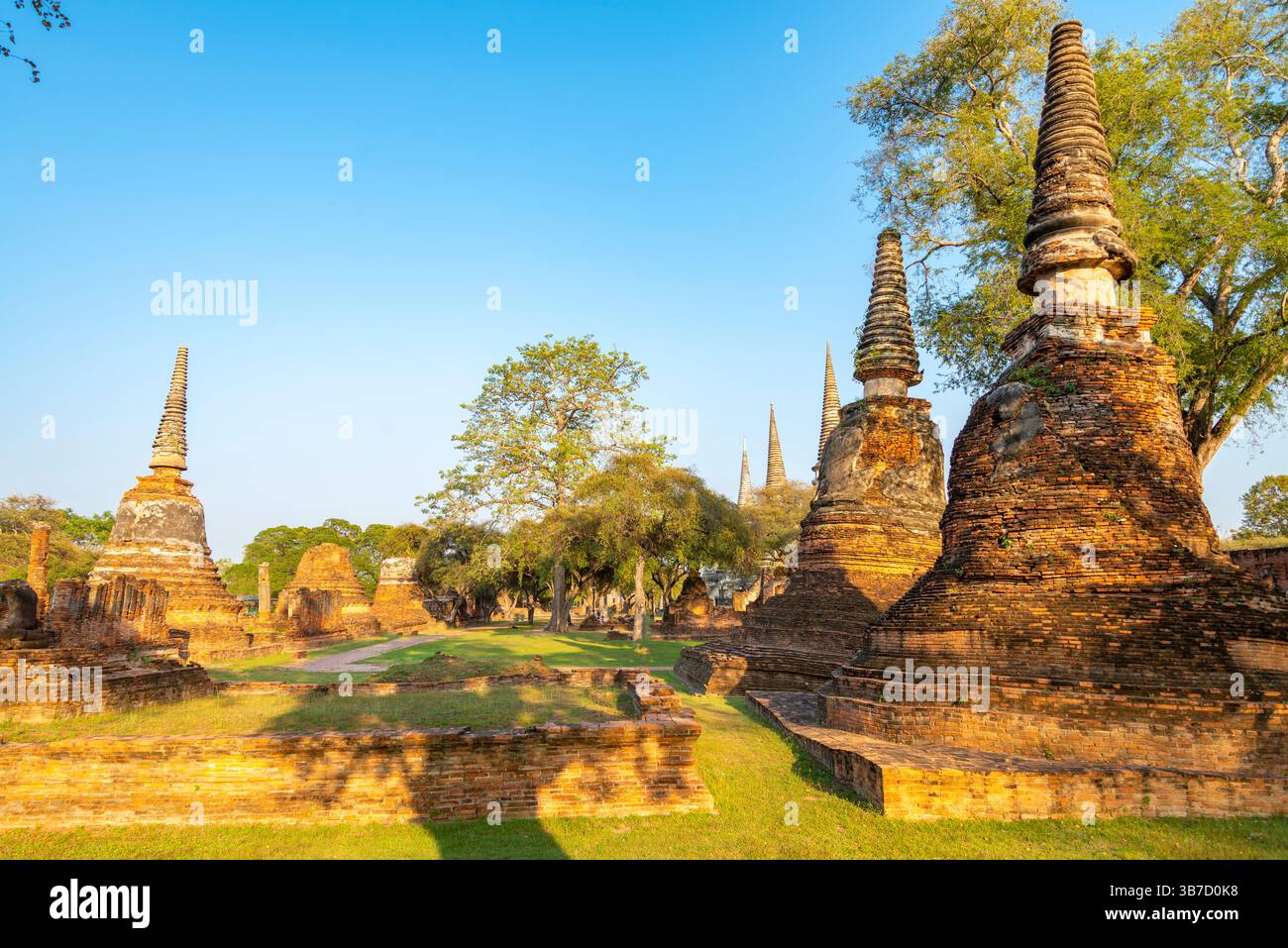 Part of the extensive temple grounds and important historic site,with many ancient Buddhist pagodas,with surrounding brickwork,stood amongst trees,bat Stock Photo