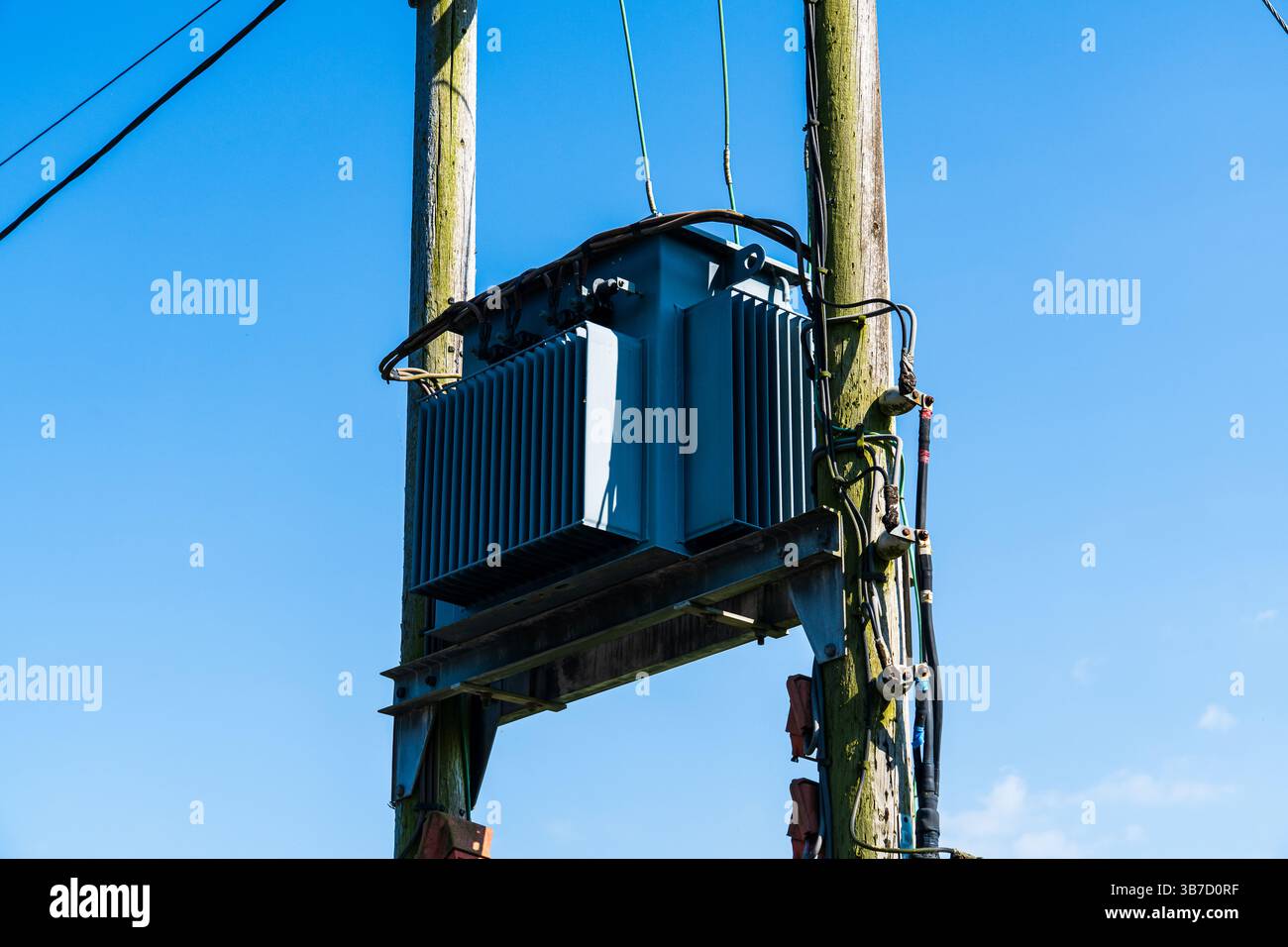 Uk Roeu Transformer Closer view of a UK electricity pole transformer on a wooden frame ...