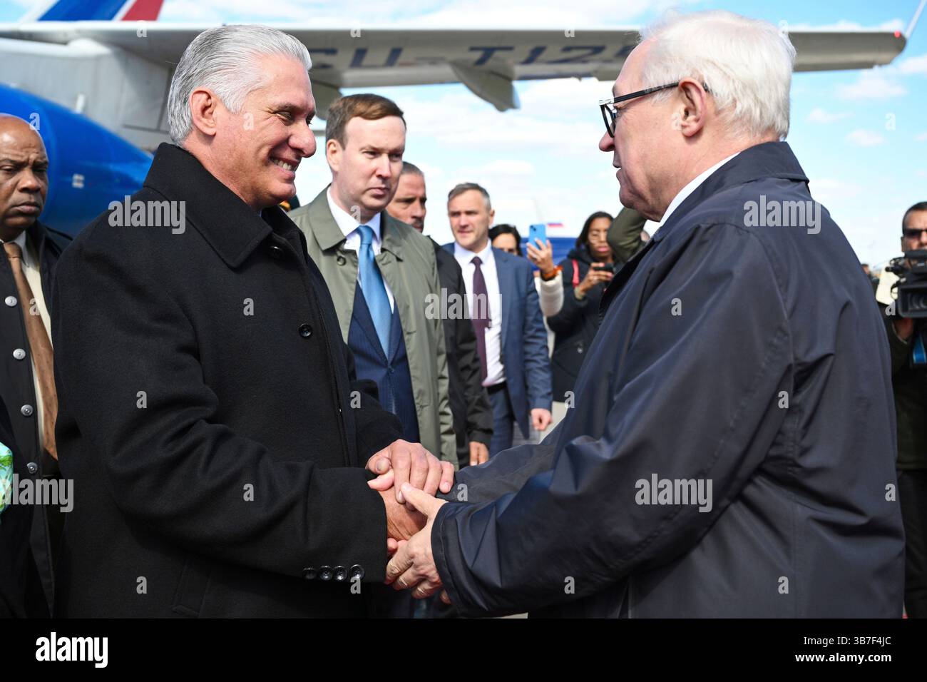 Cuba's President Miguel Diaz-Canel, left, is greeted by Russian Deputy ...