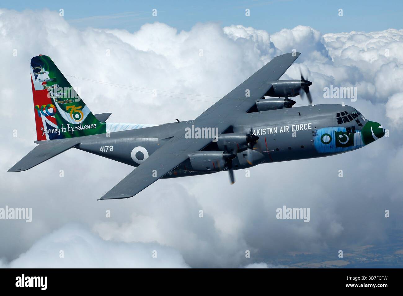 The Pakistan Air Force Lockheed Martin C-130E Hercules, registration 4178, is a transport aircraft painted in an anniversary livery featuring distinctive tail art. It is used for airlift, tactical transport, and logistics operations. Stock Photo