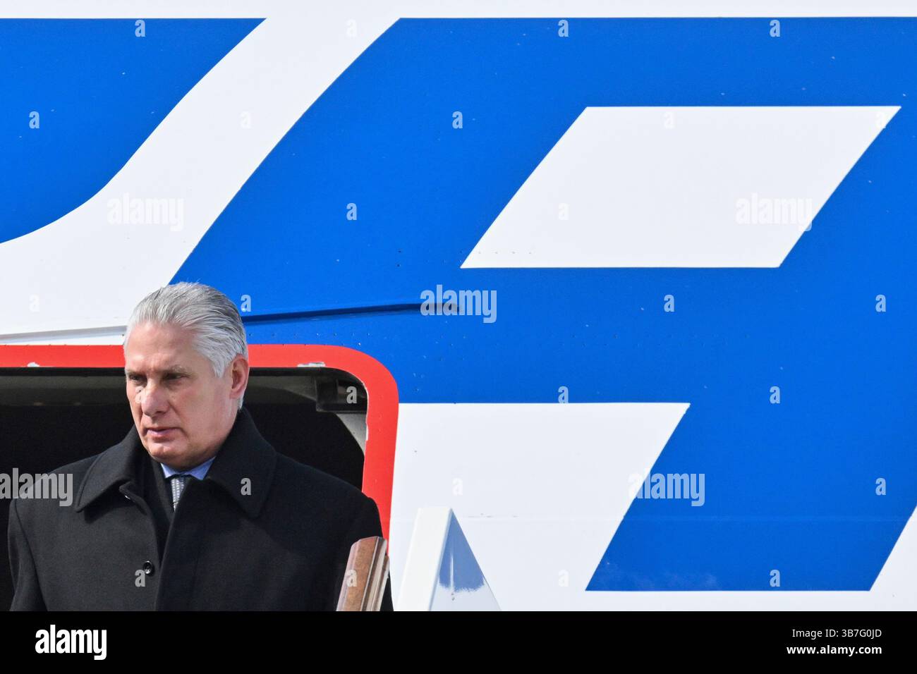 Cuba's President Miguel Diaz-Canel leaves a plane upon arrival at the ...