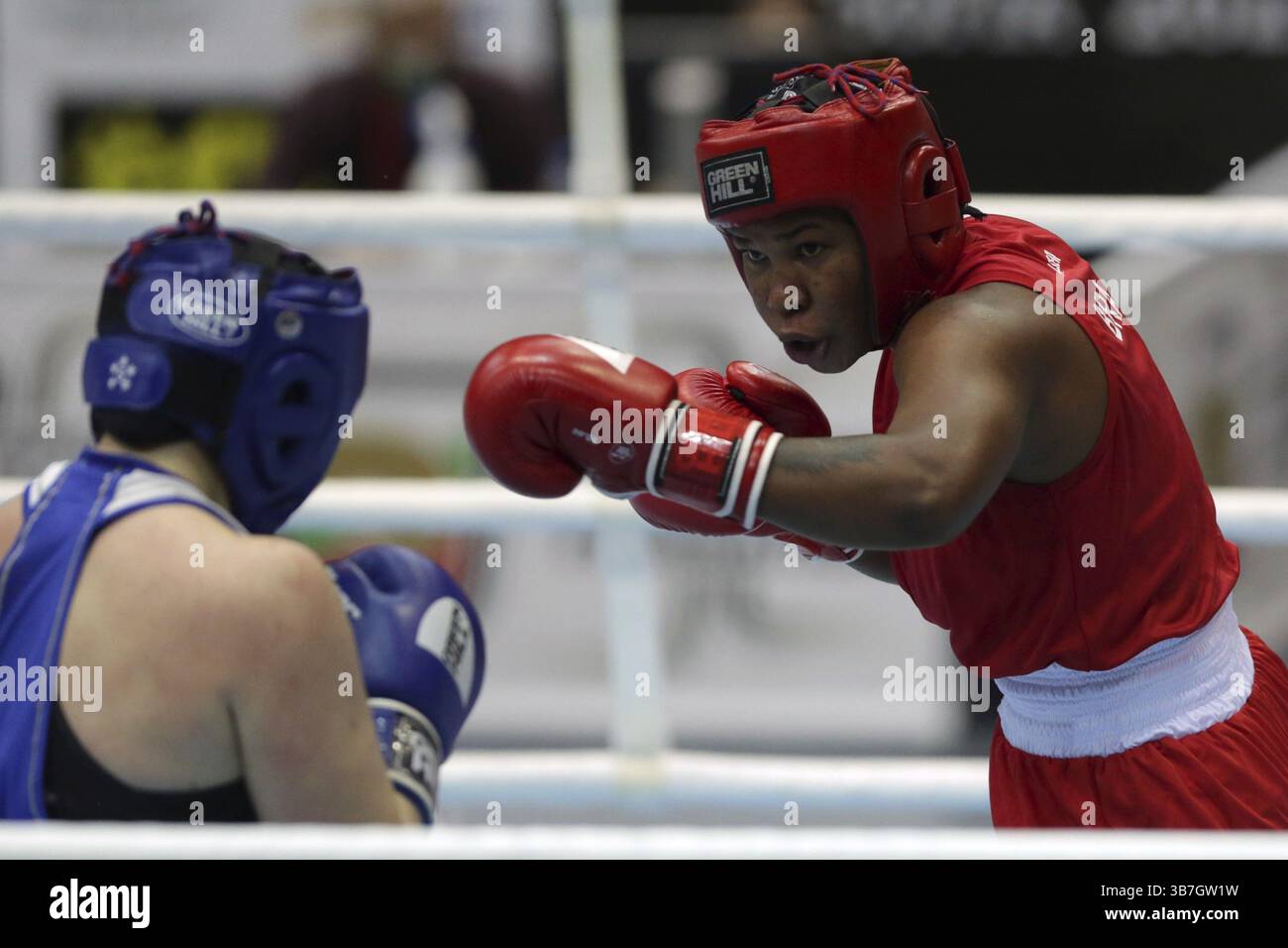 Sofia, Bulgaria - 26 February, 2021: Possantos Perejra (red) of Brazil and Nadezhda Ryabets of Kazakhstan fight in their semifinal round of Middle (W7 Stock Photo
