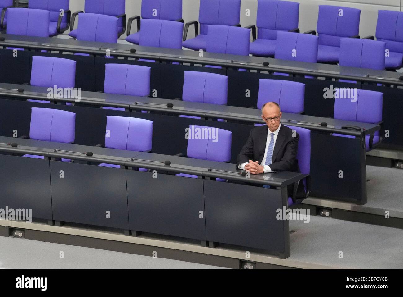 Chancellor Friedrich Merz sits on the government bench after taking the ...