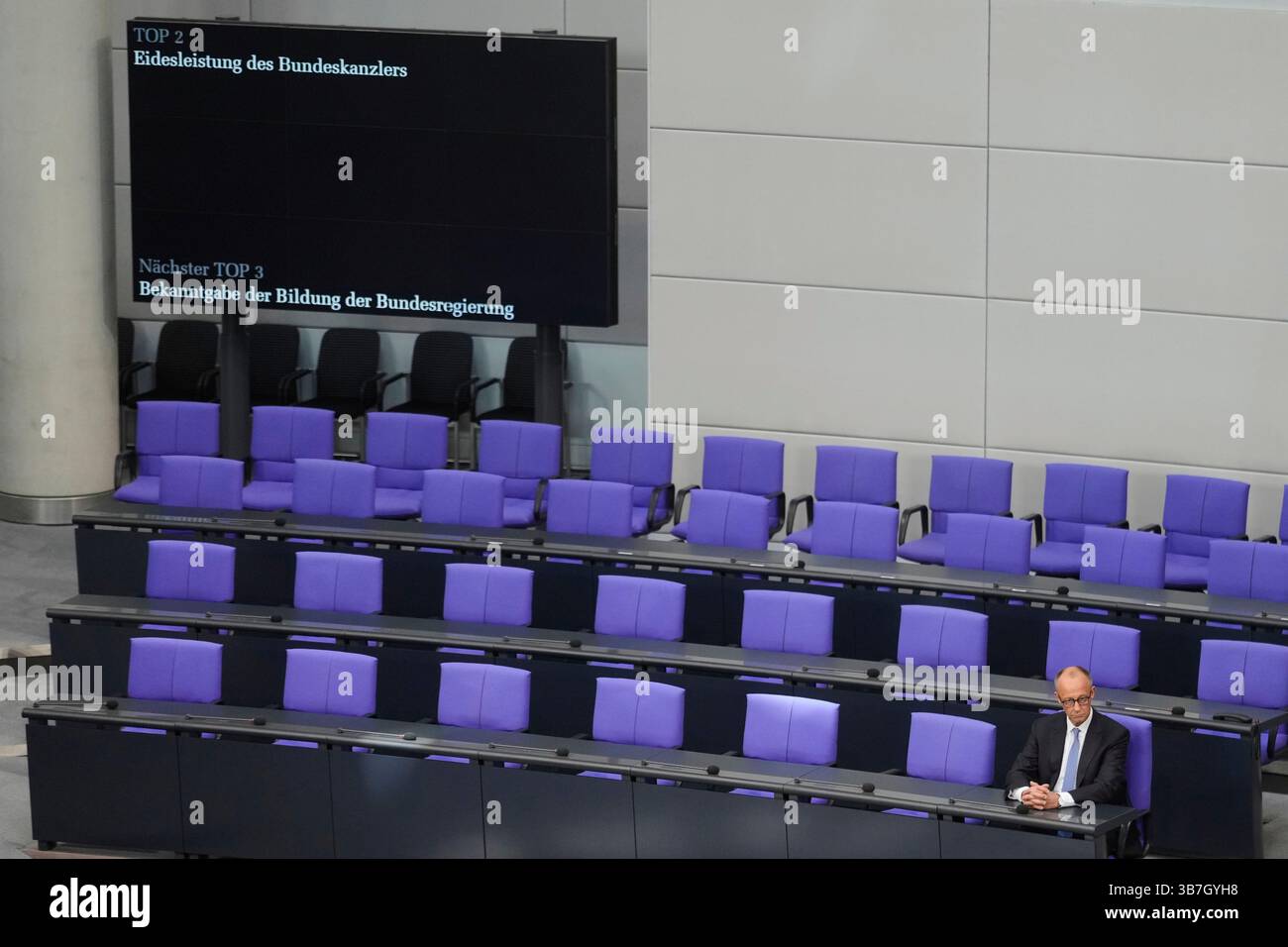 Chancellor Friedrich Merz sits on the government bench after taking the ...