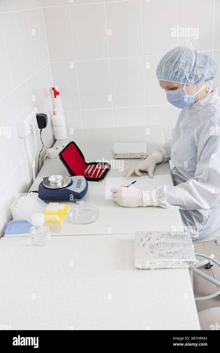 Doctror writes a note in the laboratory Stock Photo