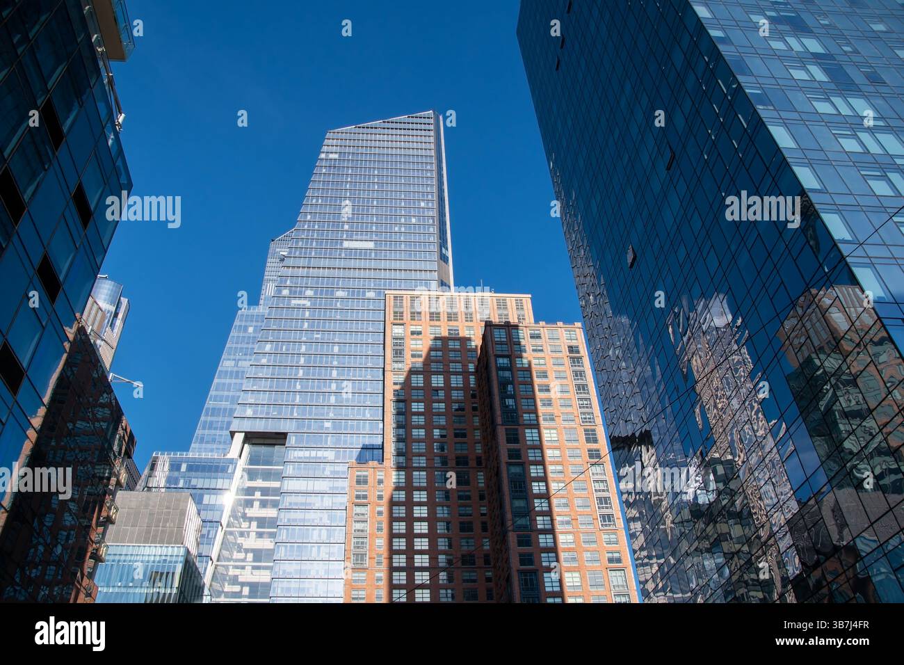 Modern high rise towers in Manhattan near High Line Park with busy city ...