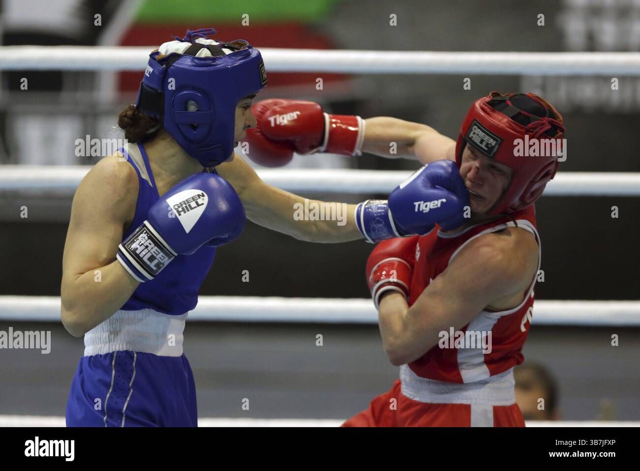 Sofia, Bulgaria - 26 February, 2021: Mira Potkonen (red) of Finland and Karina Ibragimova of Kazakhstan fight in their semifinal round of Light Welter Stock Photo