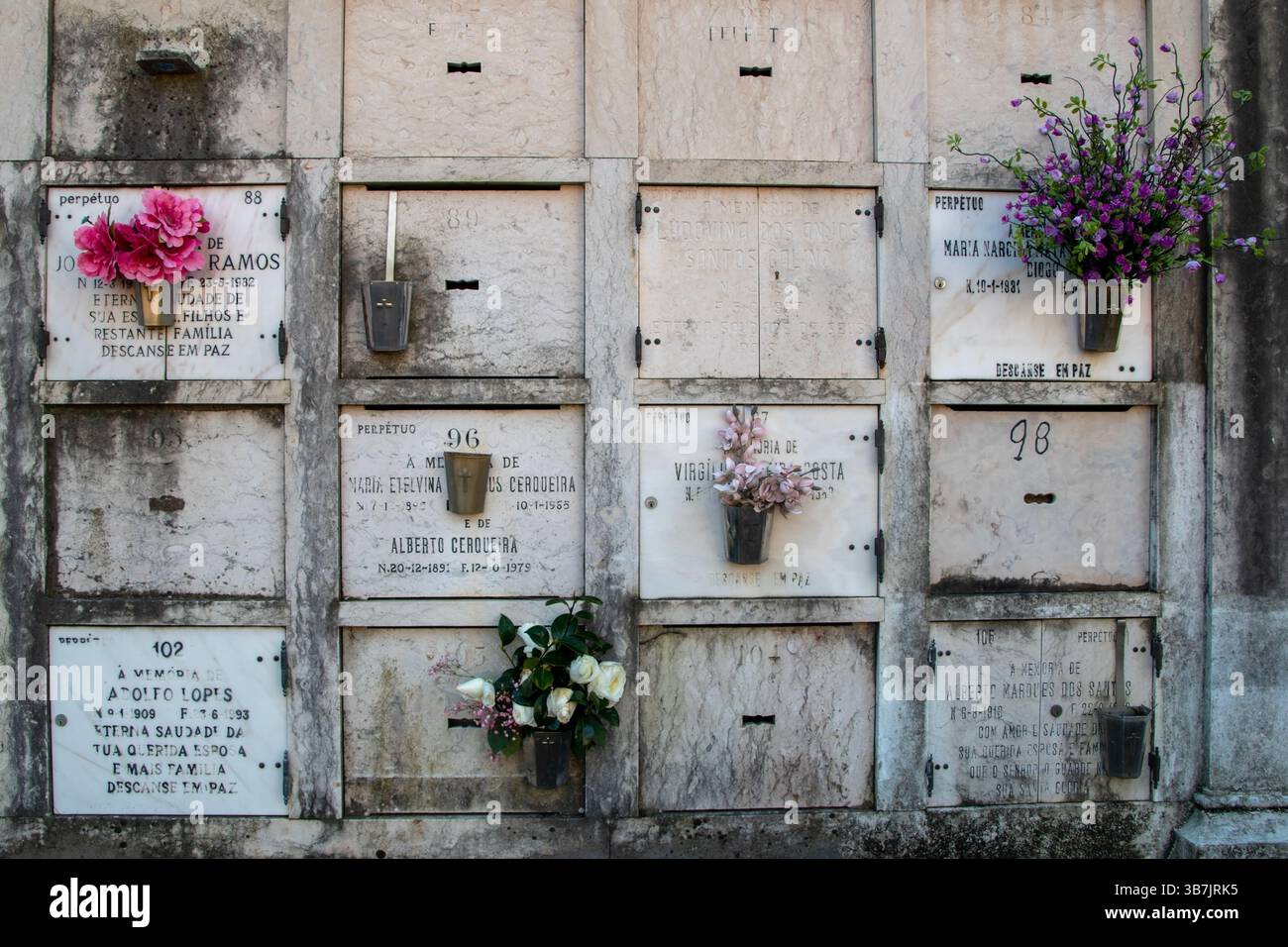 Historic crypt surrounded by decayed headstones in rural cemetery Stock ...