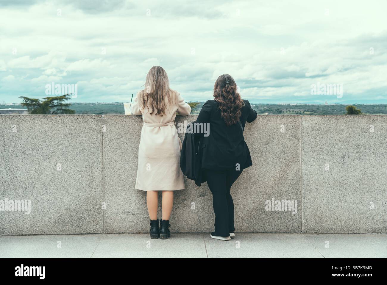 Two women standing together hi-res stock photography and images - Alamy