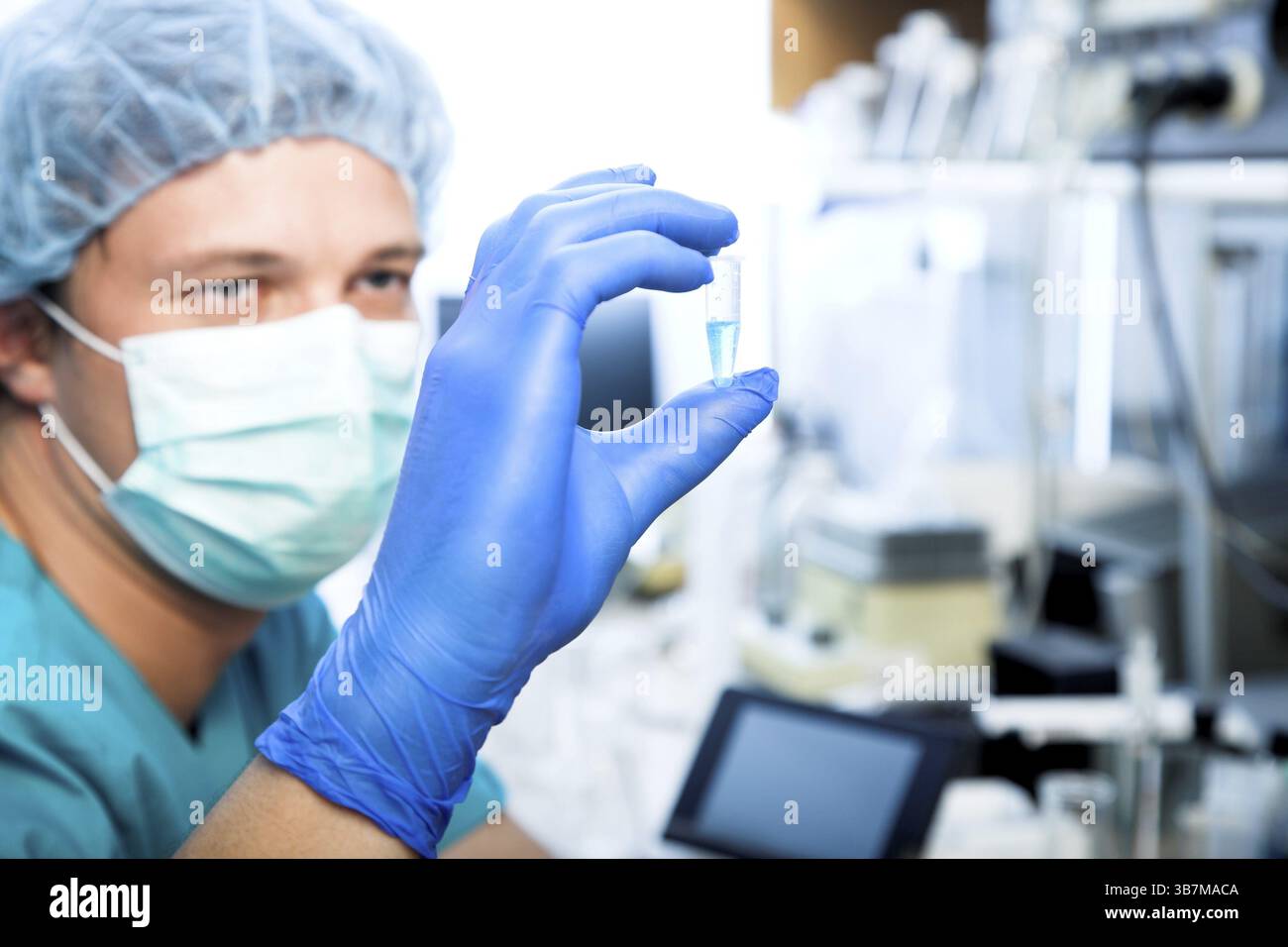Scientist doing DNA test in modern laboratory Stock Photo