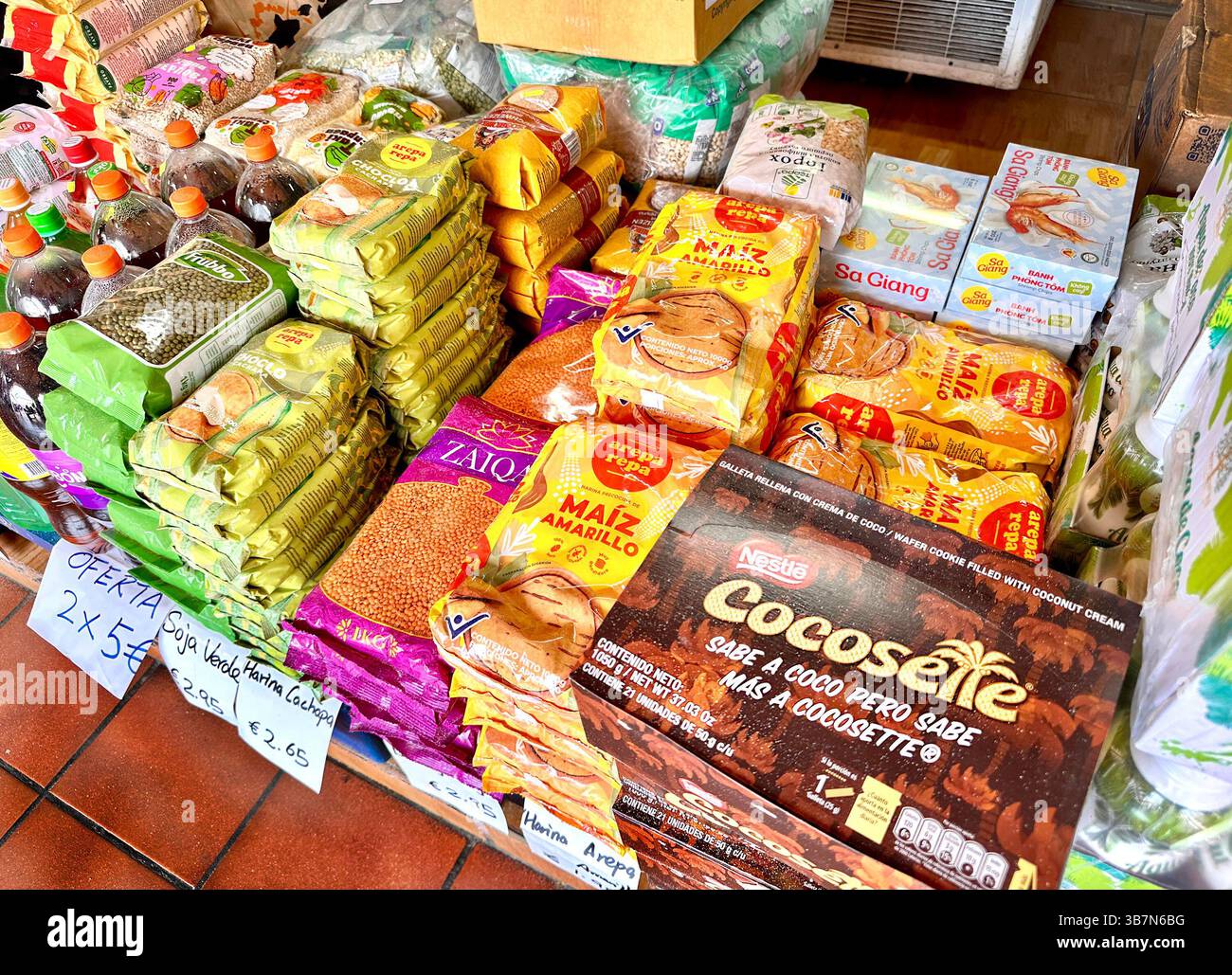 dry goods  stacked on tiled floor such as maze and lentils in a supermarket in santa cruz tenerife canary islands spain - Smartphone Captured Stock Image