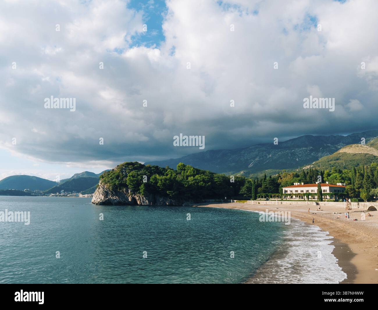 The Villa Milocer is one of the most beautiful resorts of the Budva riviera surrounded by the shady park, with the famous Queen's Beach on the foregro Stock Photo