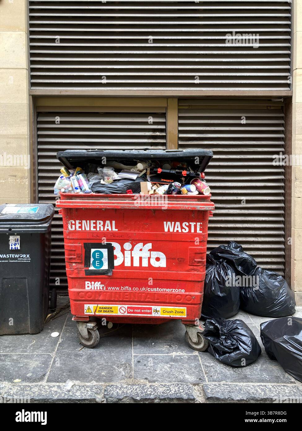 Communal bin for non recyclable general waste in an Edinburgh Street, Scotland, UK - Smartphone Captured Stock Image