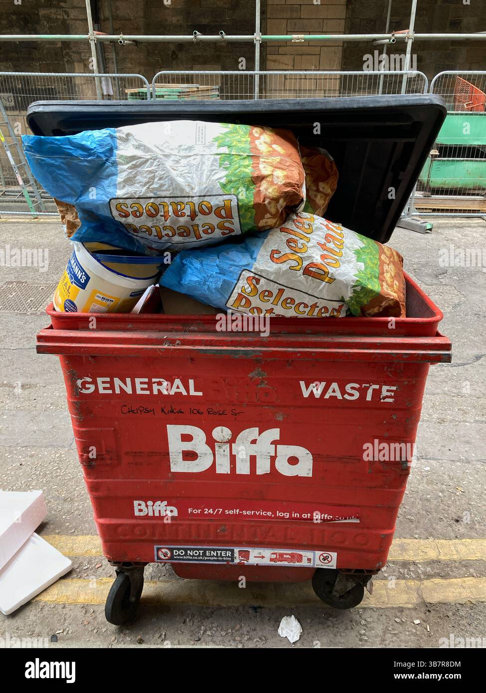 Communal bin for non recyclable general waste in an Edinburgh Street, Scotland, UK - Smartphone Captured Stock Image