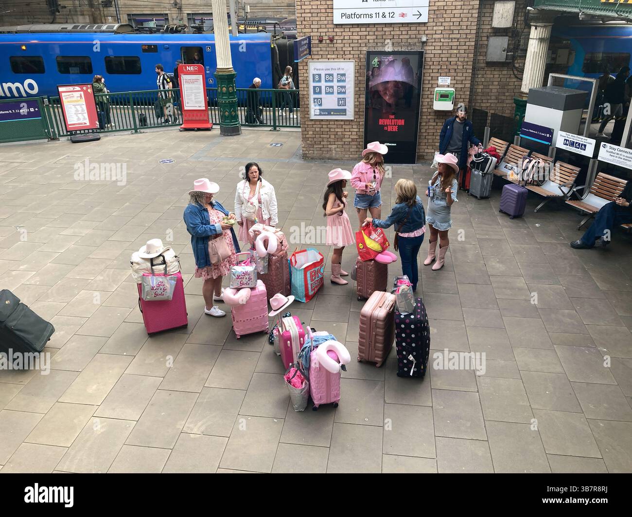 Group of lady travellers on Waverley station concourse, Edinburgh Scotland - Smartphone Captured Stock Image