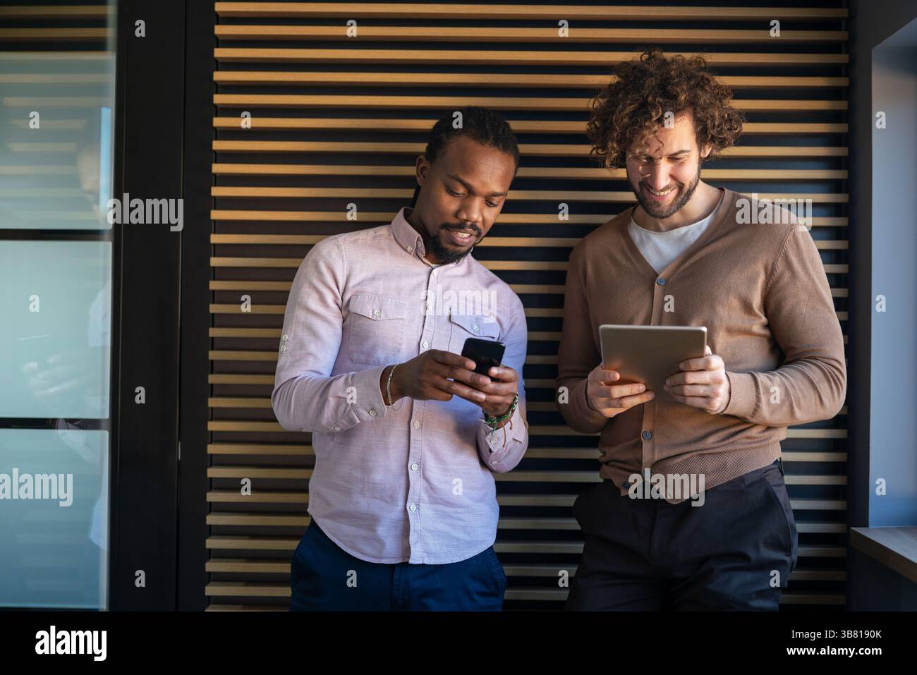Happy software developers working on meeting, Programming advanced code artificial intelligence. Stock Photo