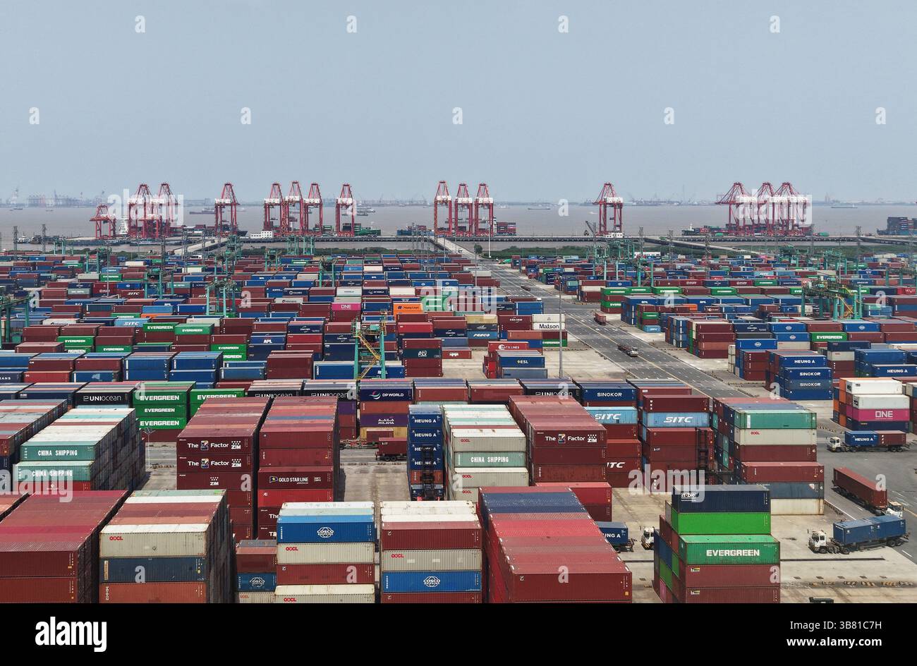 Shuttle Container Port Trucks loaded with containers shuttle back and forth at a container ...