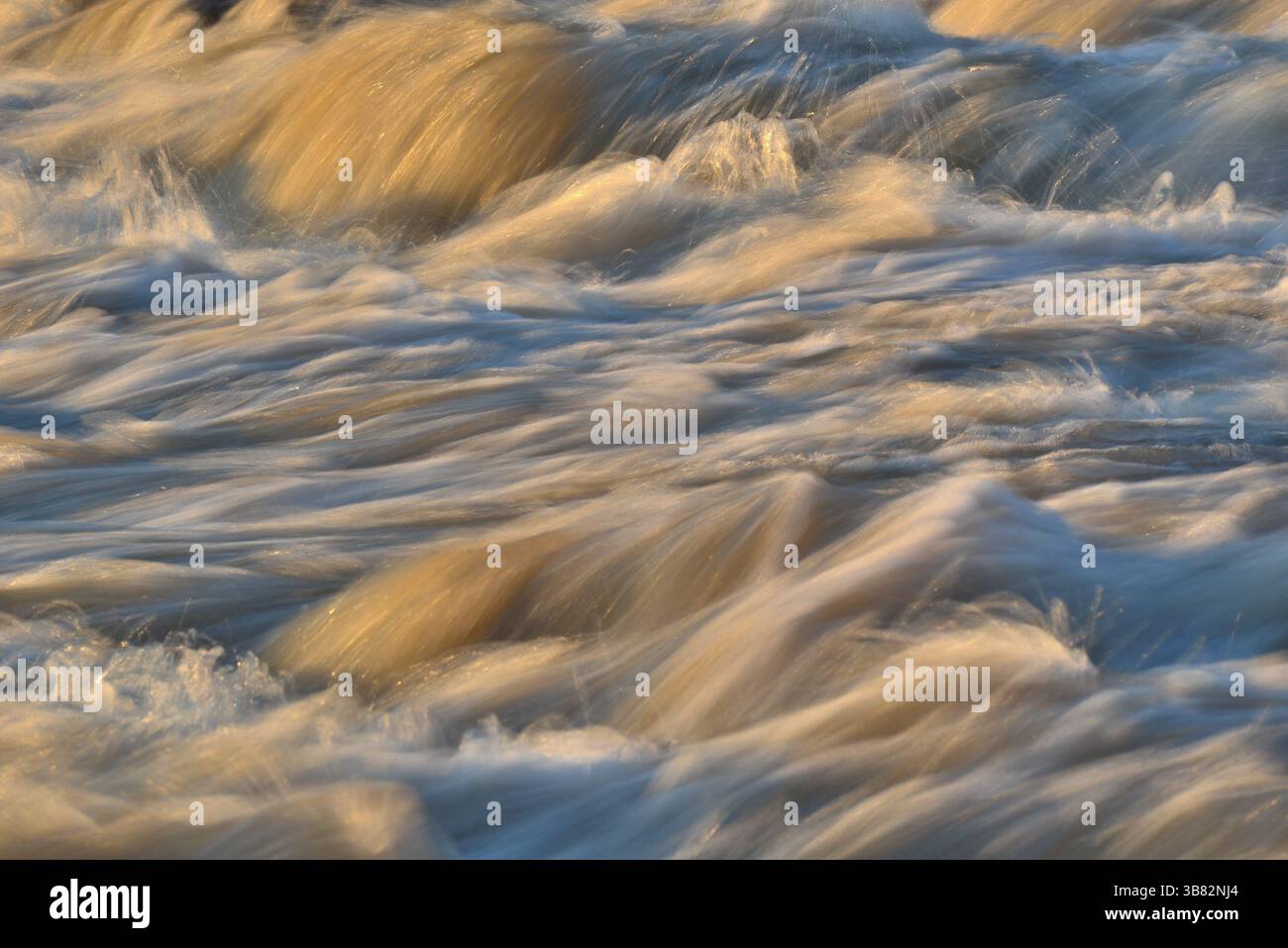 Fast-flowing mud water in the river Stock Photo - Alamy